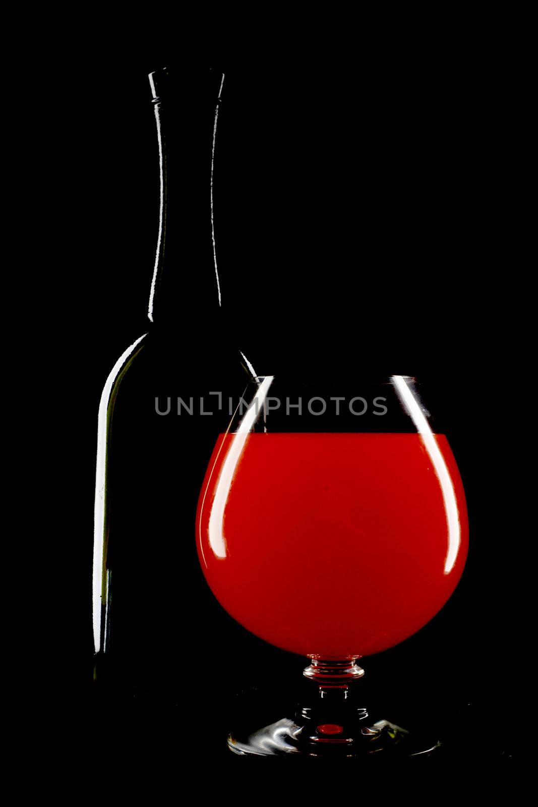 An image of bottle and wineglass