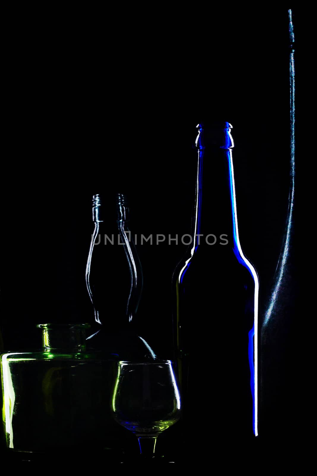 An image of glasses bottles on black background