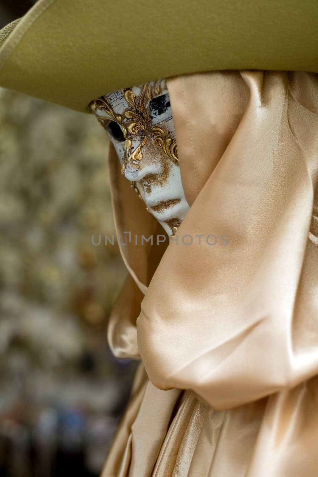 An image of a mannequin in venetian mask