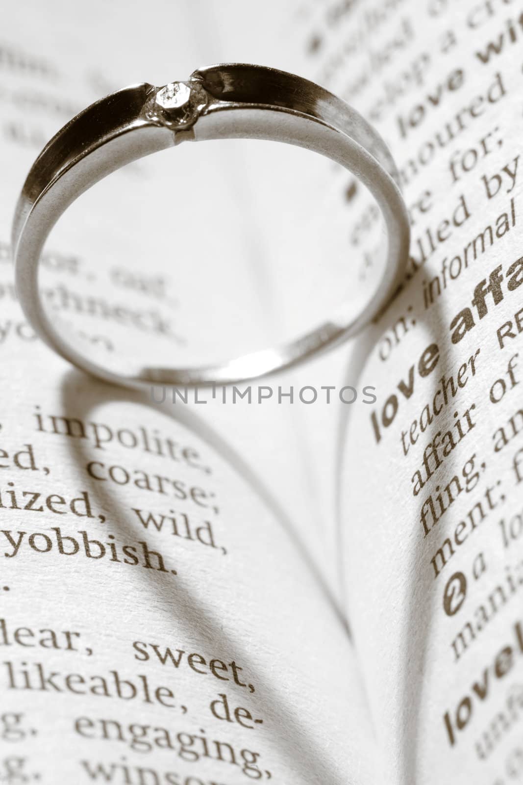 An image of a ring with shadow of a heart