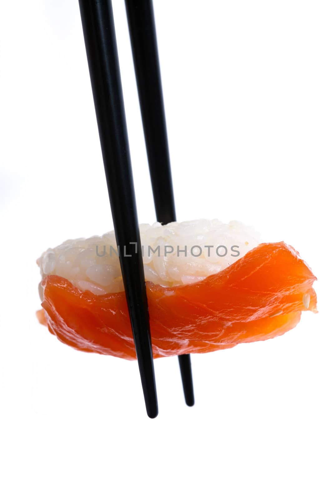 Stock Photo: Sushi with chopsticks shot on white