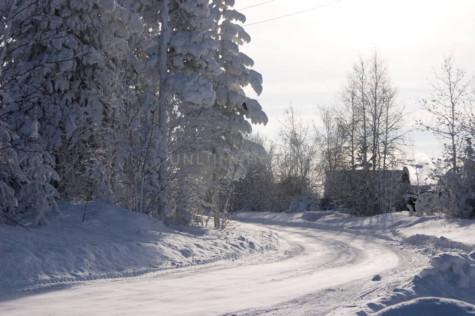 turn of winter snow bound road is in the country