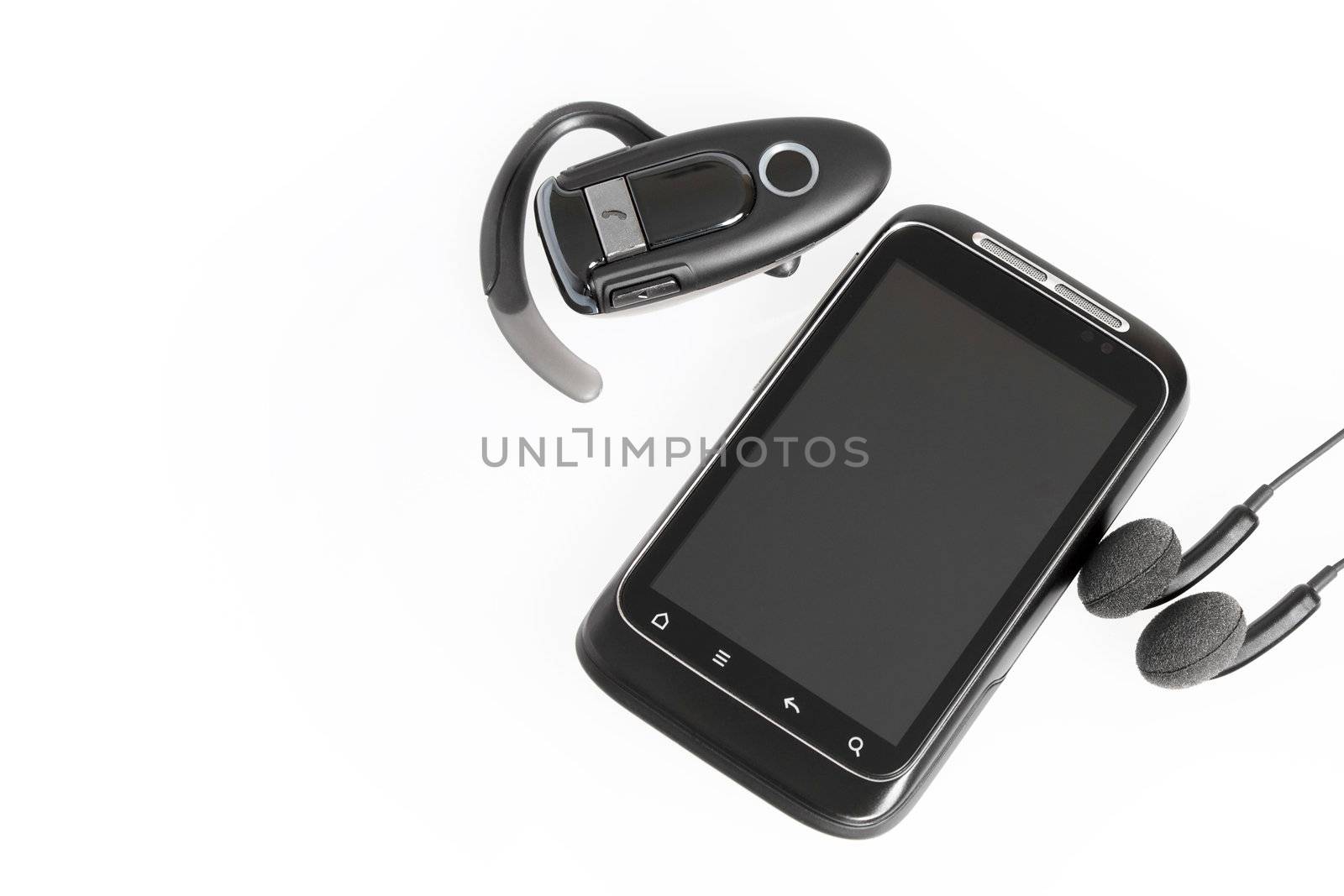 smartphone with headset handsfree and headphones isolated on white background