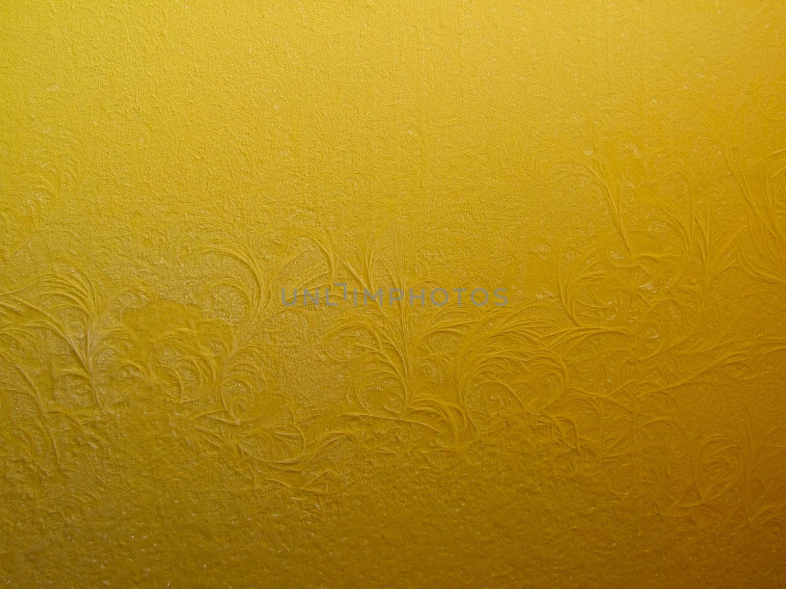 Frosty pattern on a yellow wall