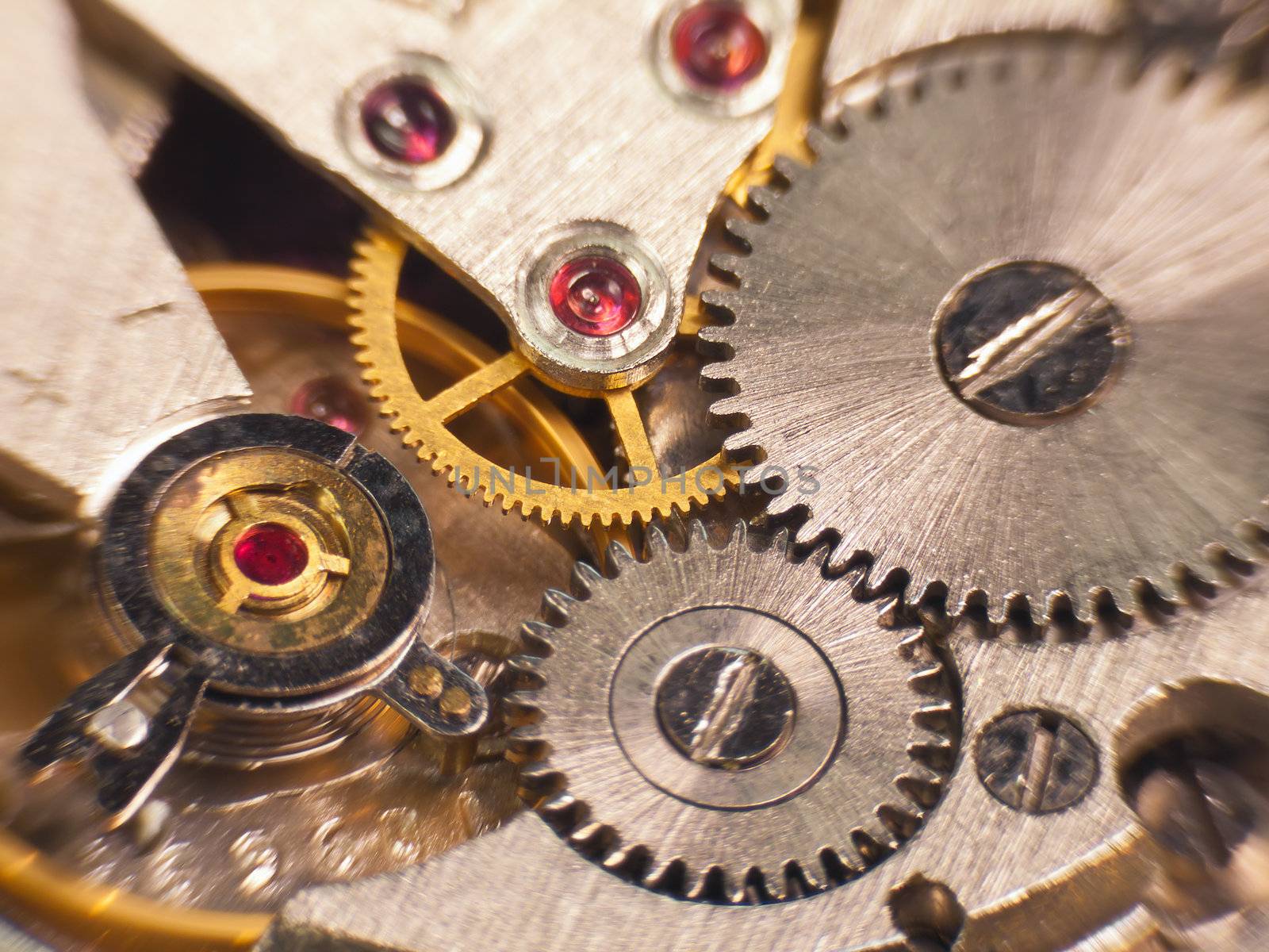 Macro photo of the mechanism of a watch soft focus