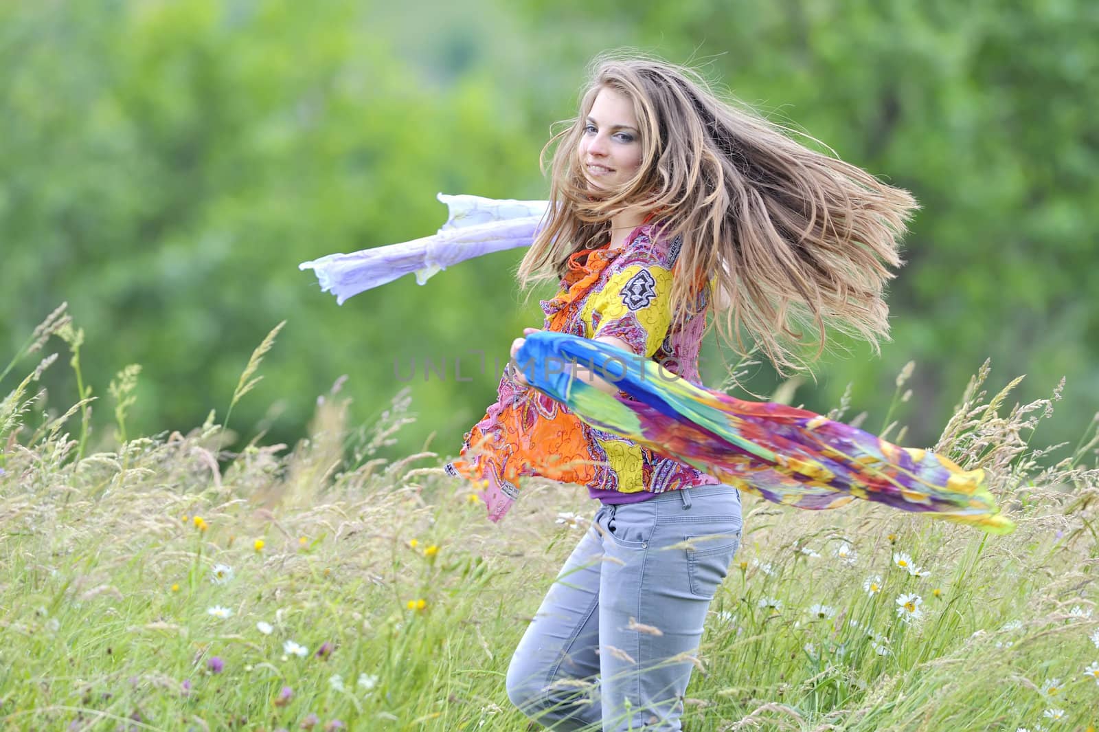Jumping girl against summer meadow by jordachelr