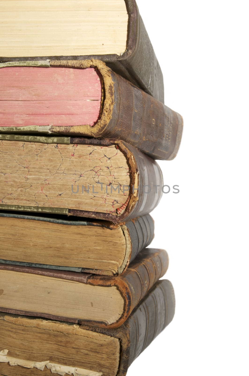 a very old book shot in close-up on a white background