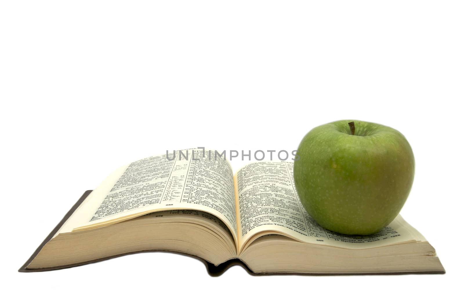 book of the Bible and an apple on a white background