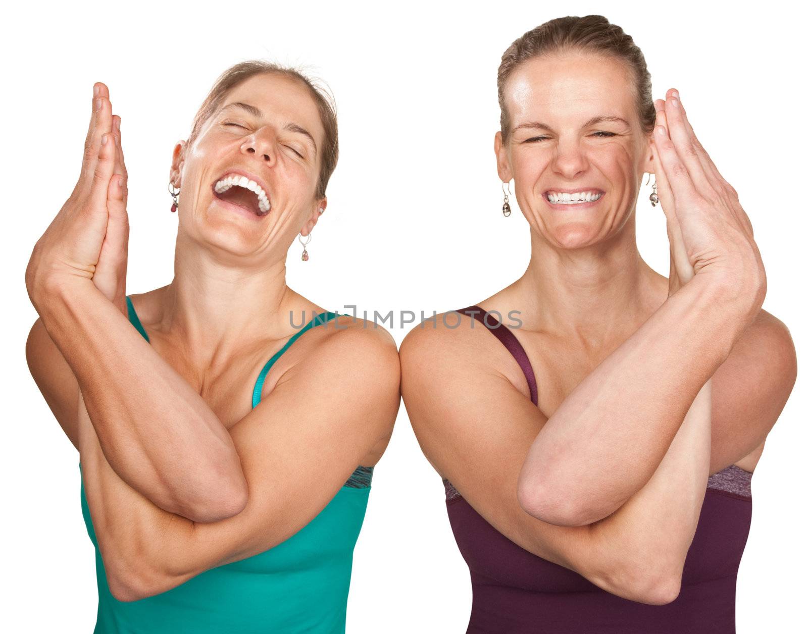 Two laughing women performing entwined namaskar over white background