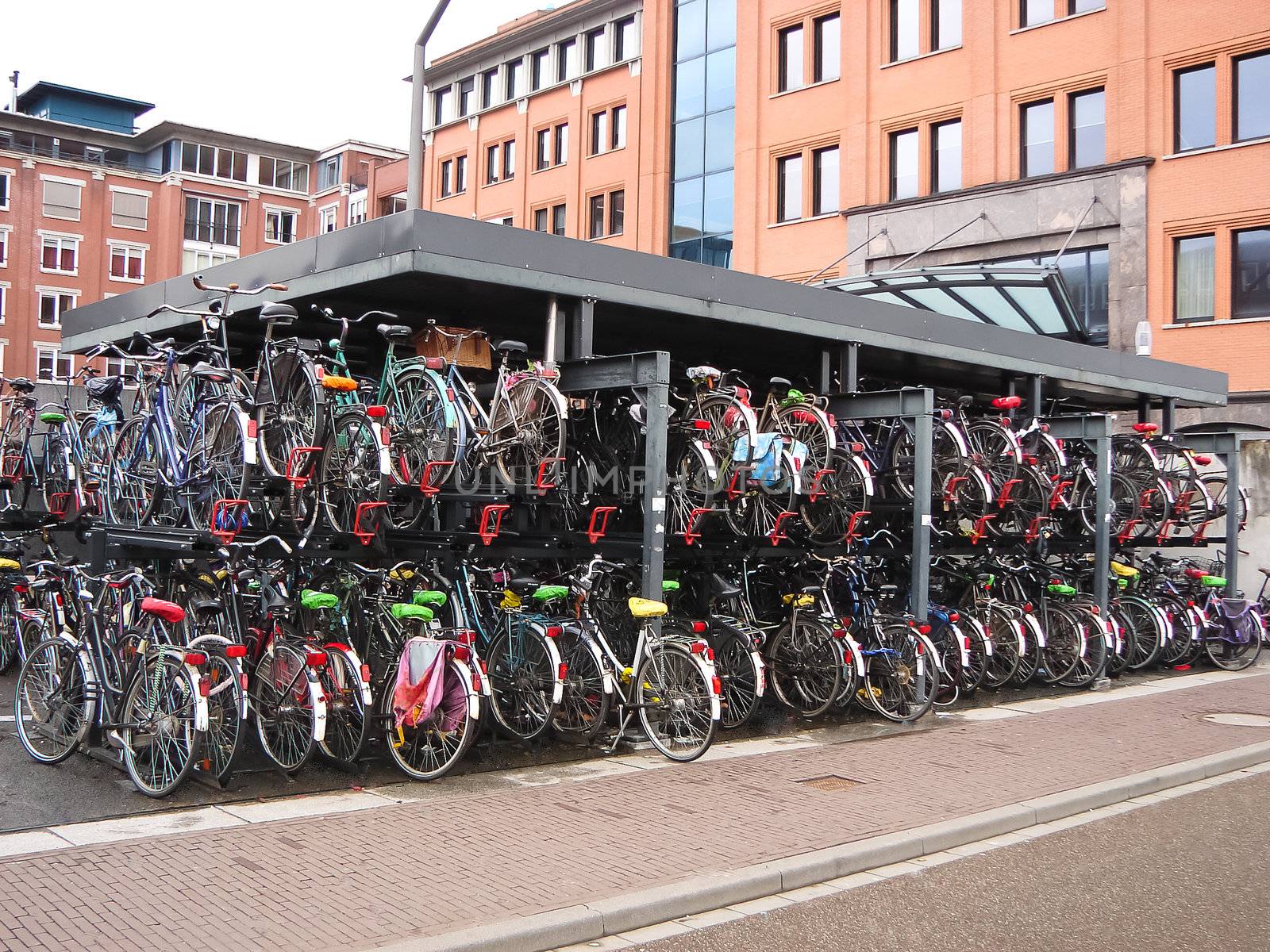 Plenty bicycles at parking lot in  by NickNick
