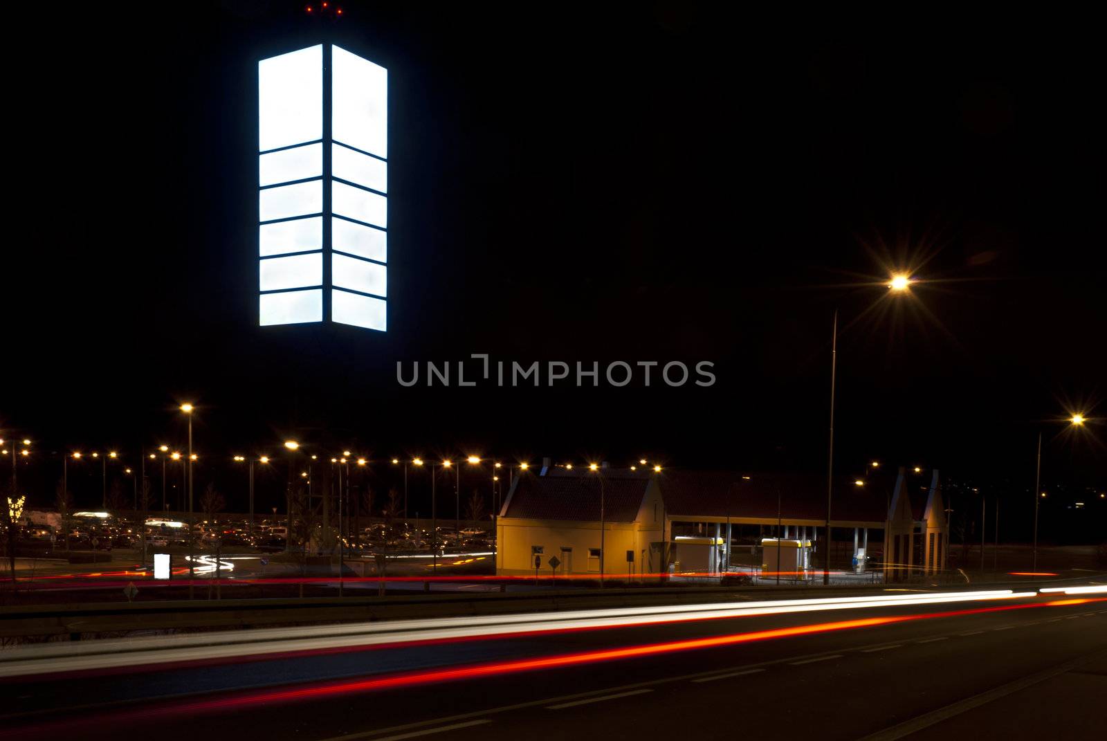 Night photo of empty billboard in the shopping park. Blurred lig by mozzyb