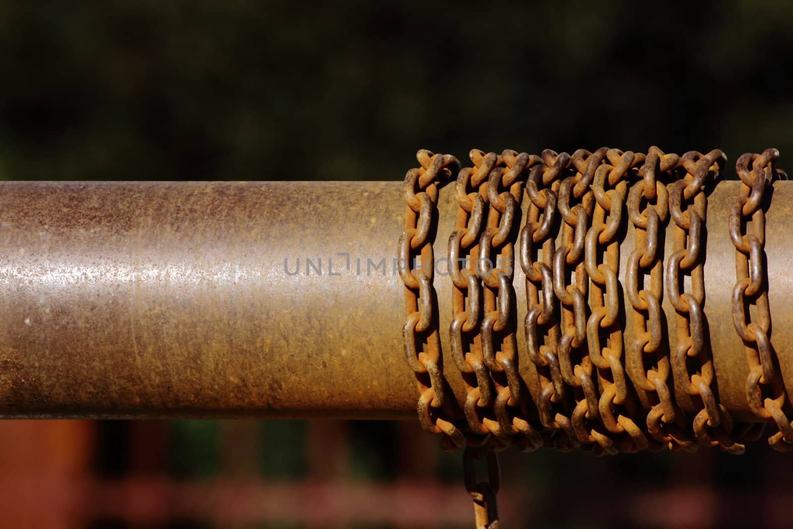 rusty chain on metal cylinder