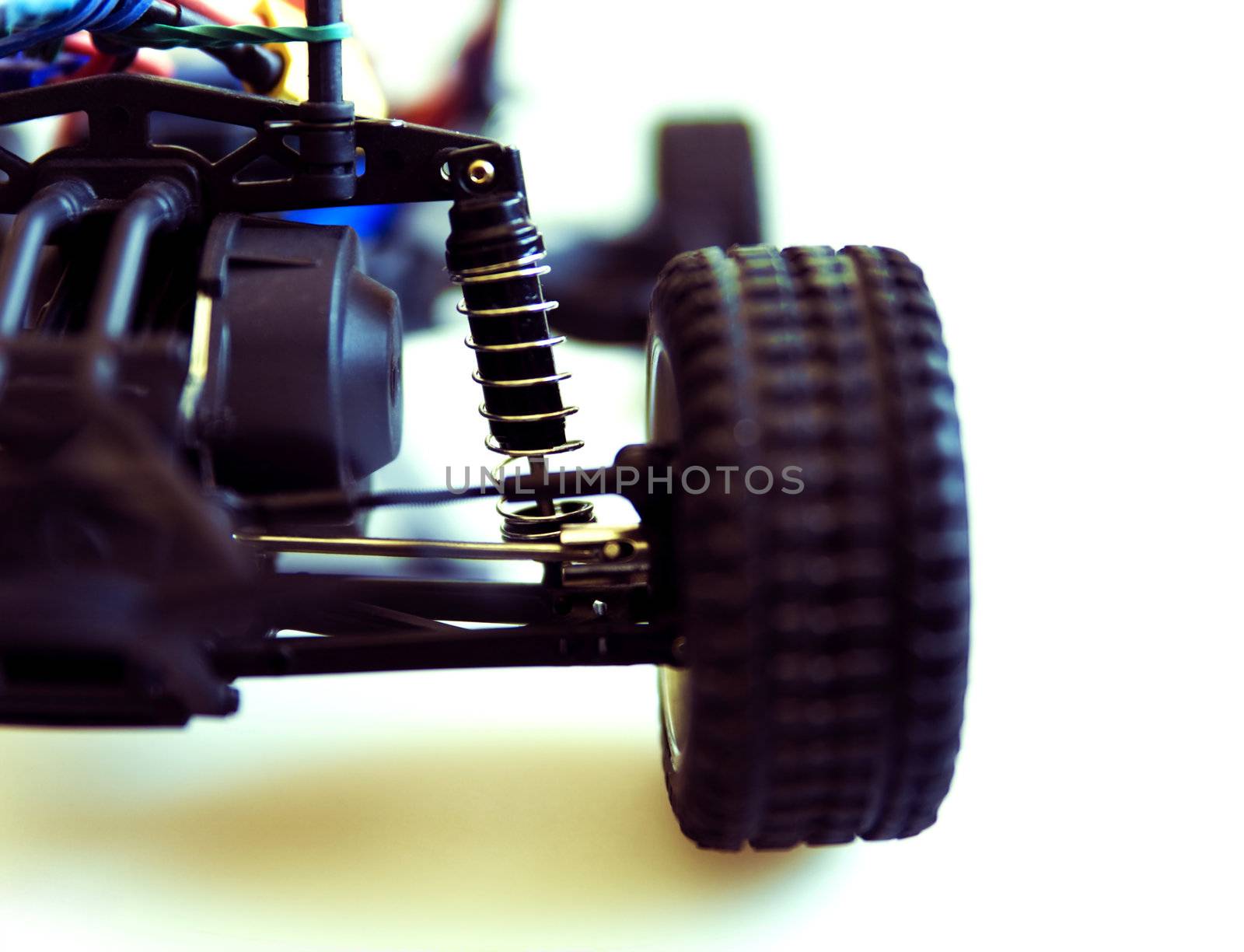 shock absorber with spring and other details of a suspension of the toy machine