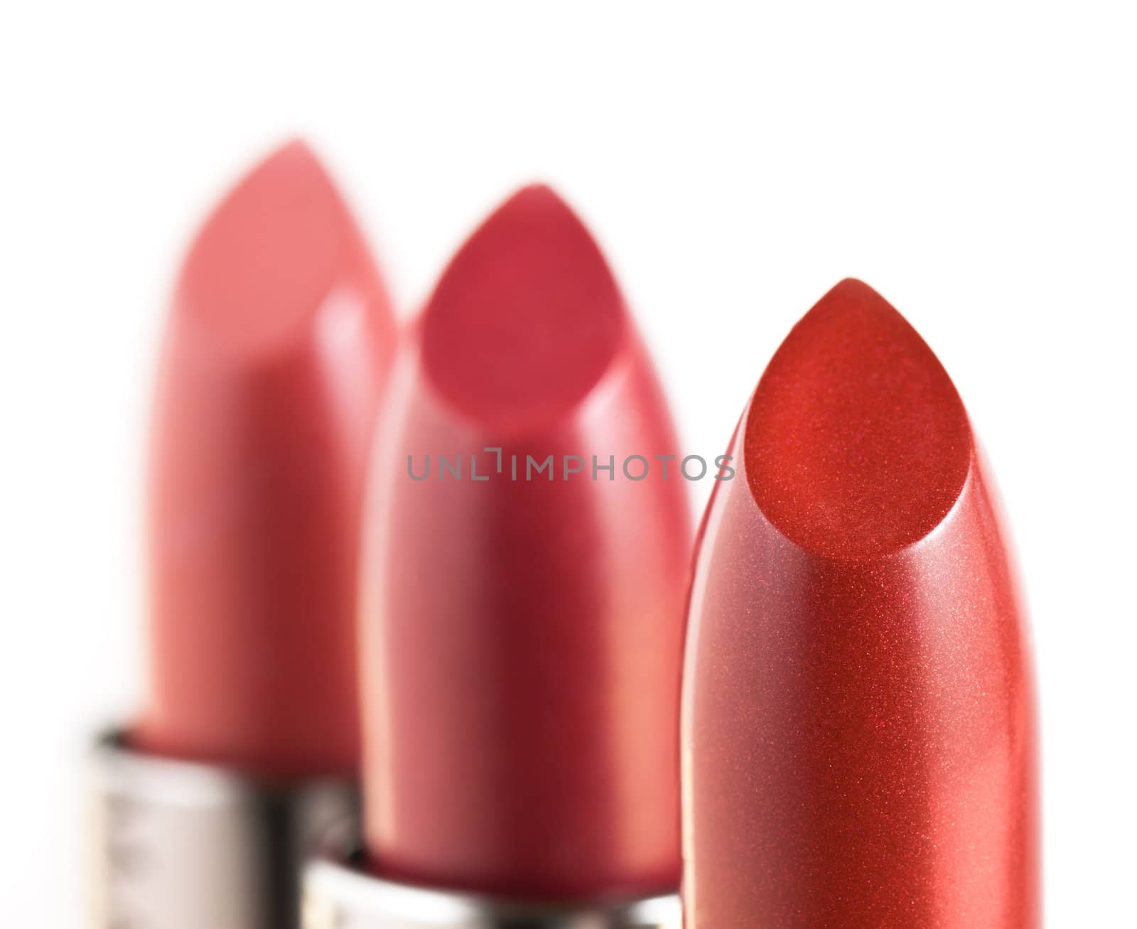 Red lipstics isolated on white