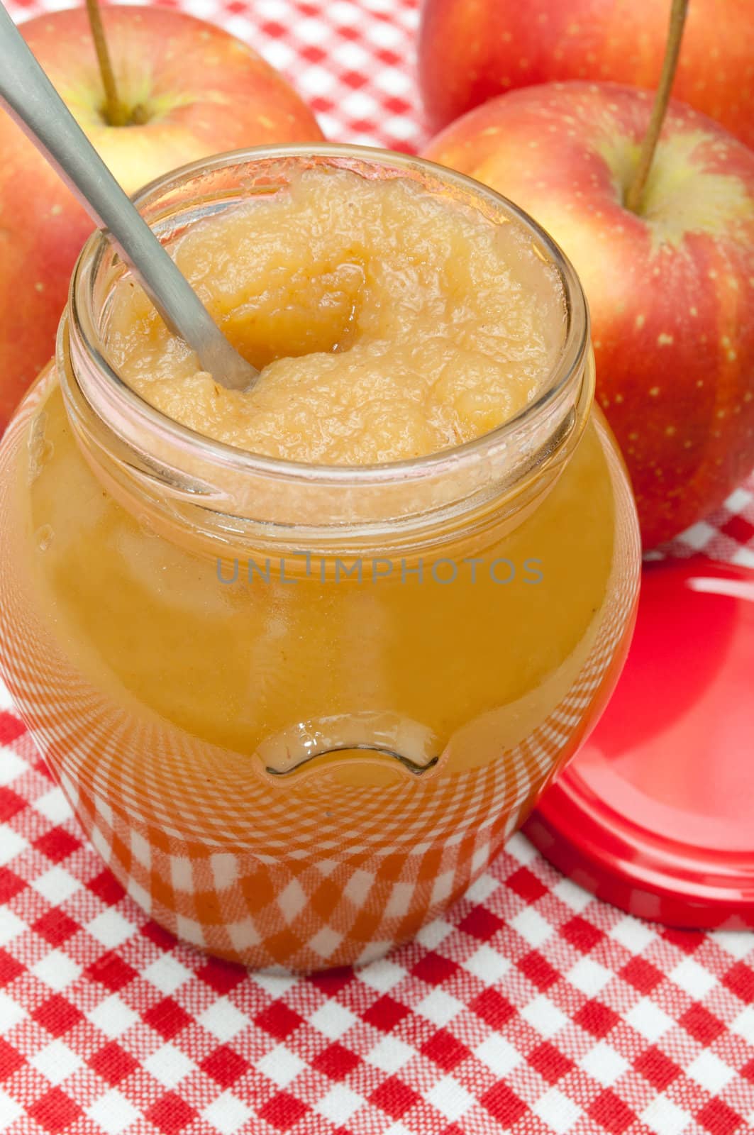 Apple Jam in Jar and Apples on Red Gingham Tablecloth