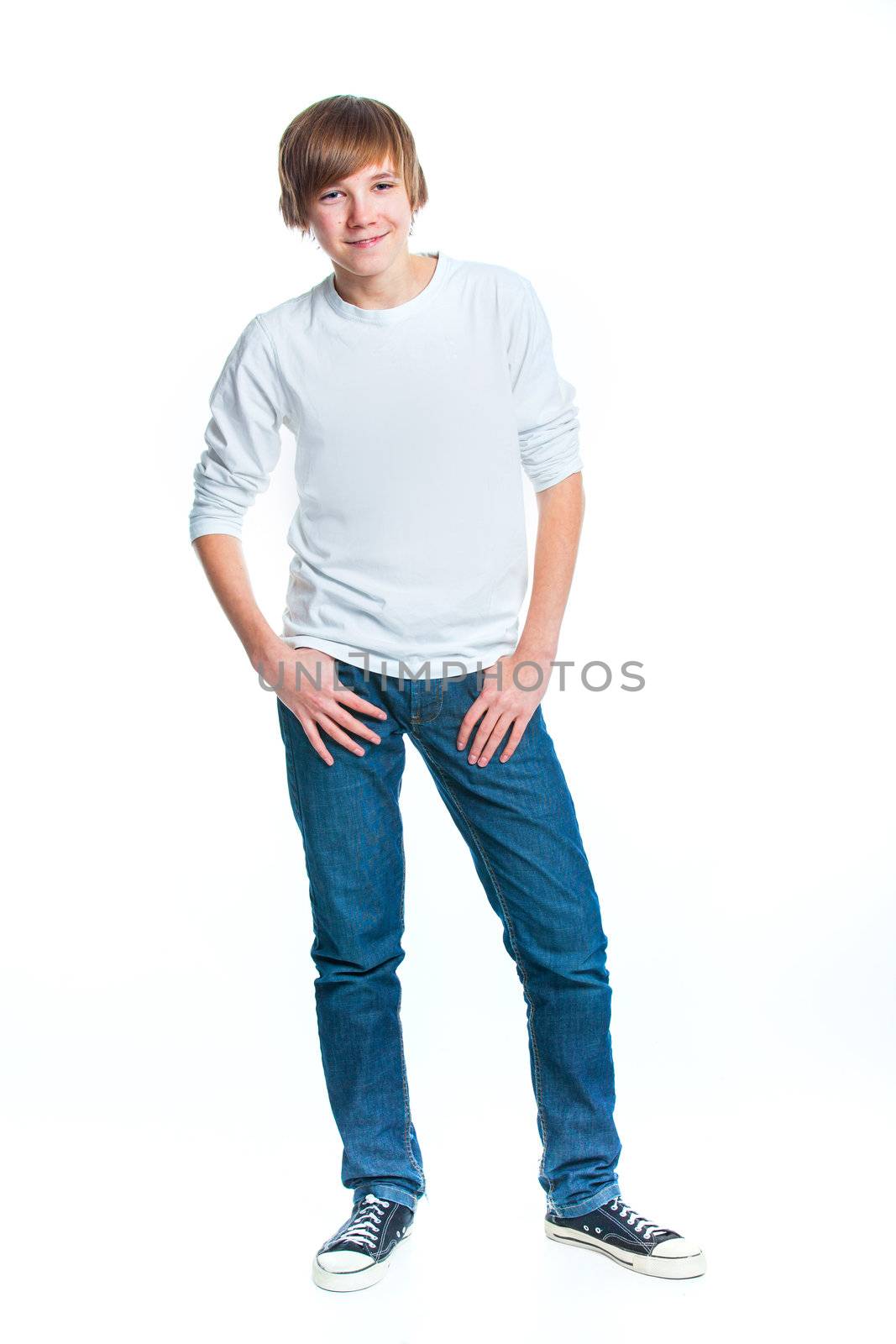Young smiling cute teenager in white, isolated on white
