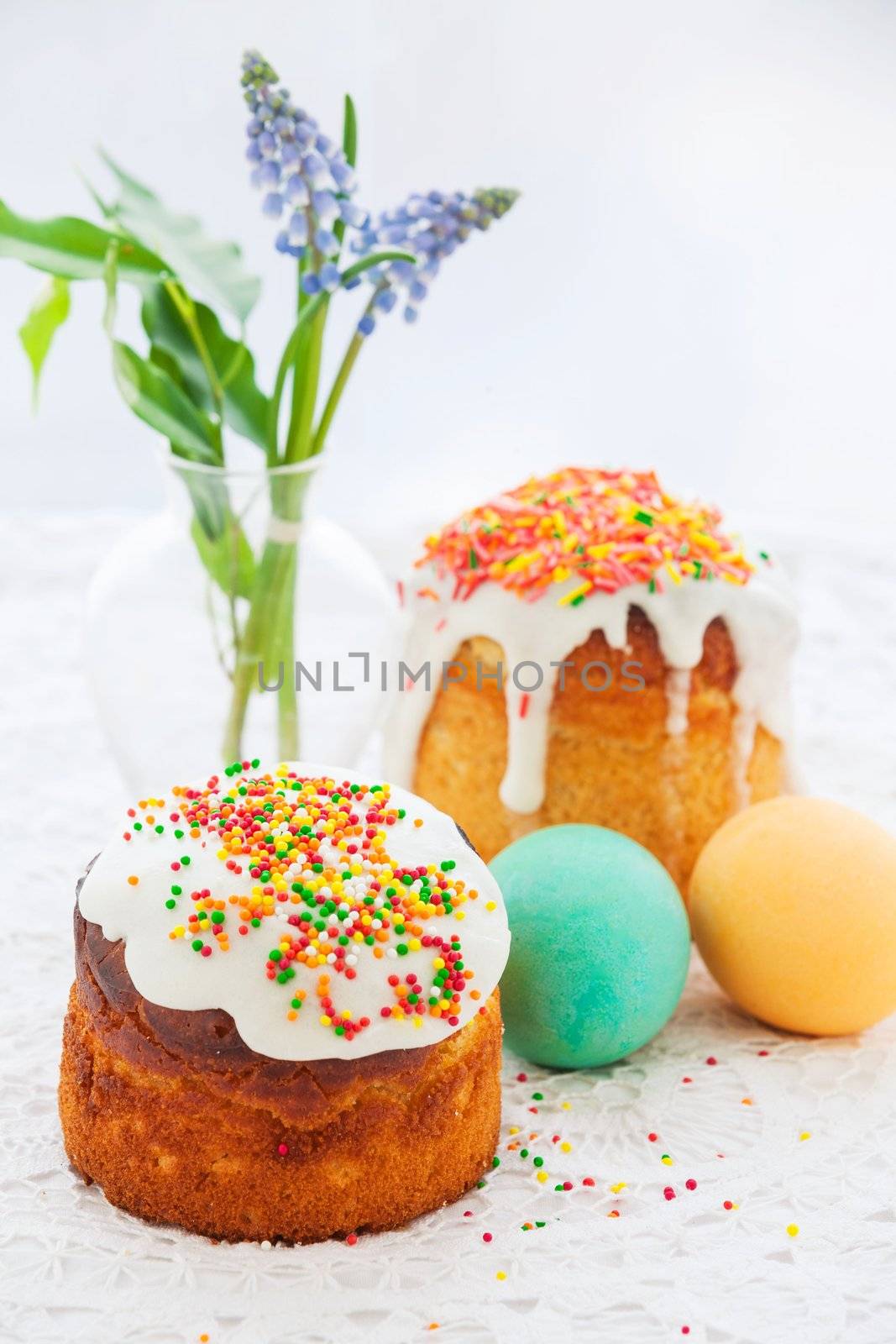 Easter cake and colorful eggs on festive Easter table