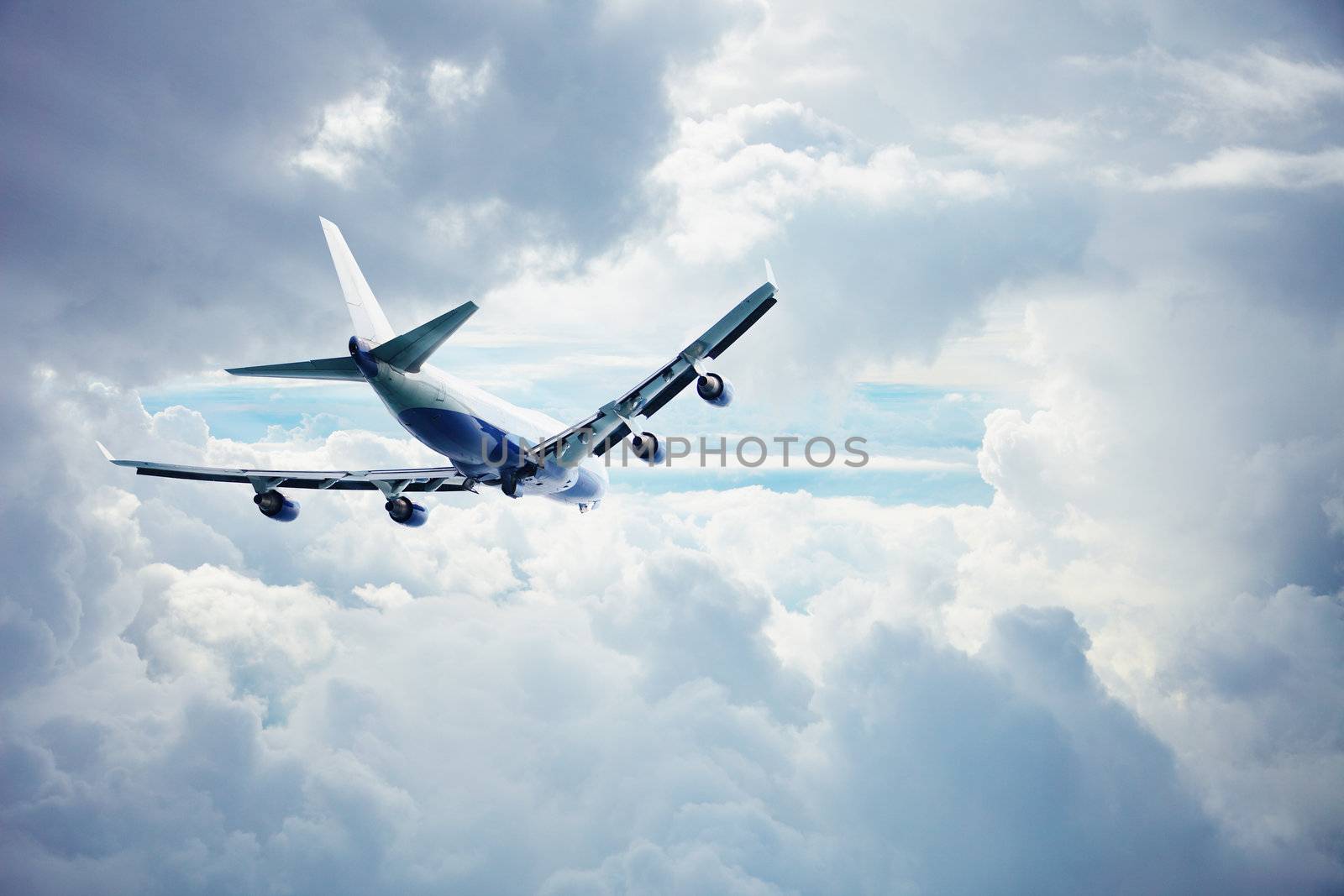 Passenger airliner flying through the thick clouds
