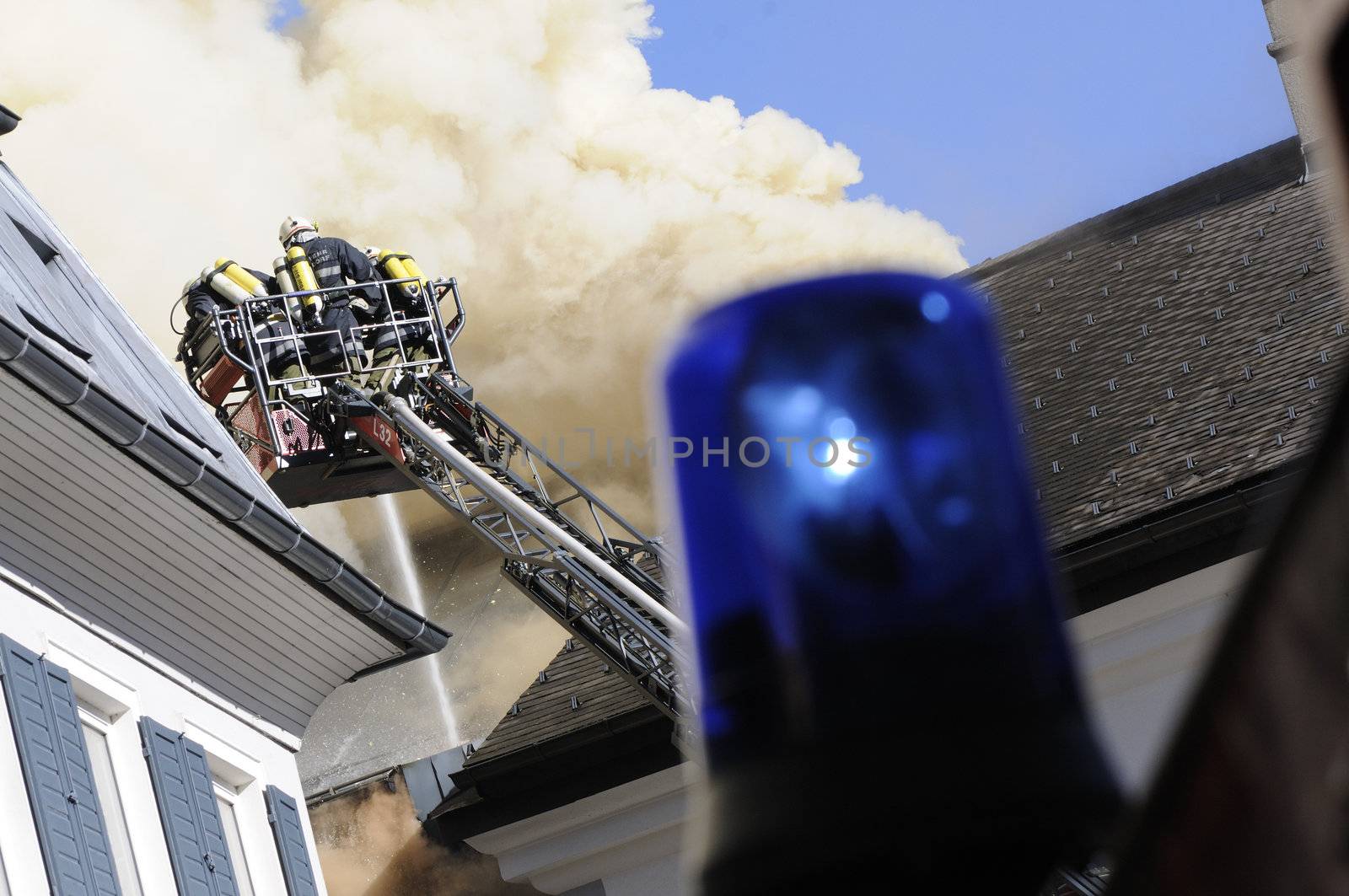 firefighter extinguish fire by fahrner