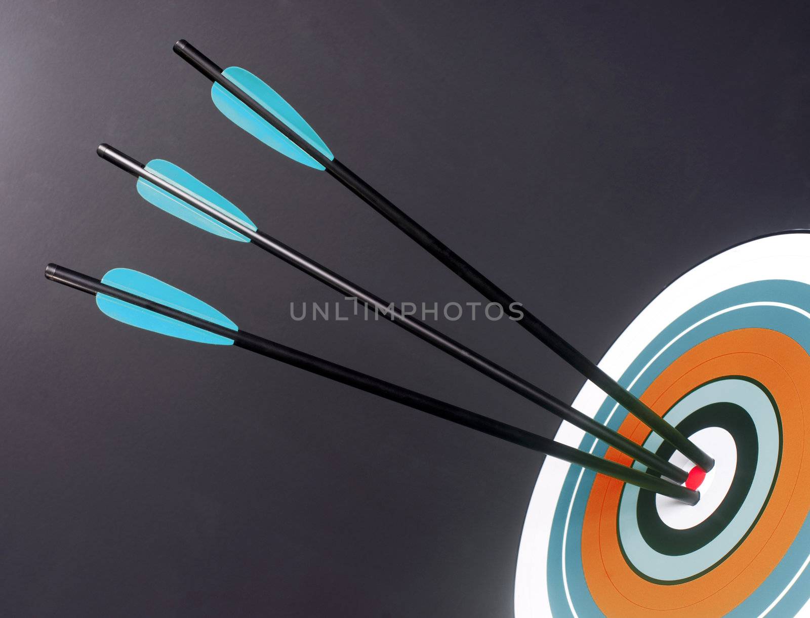Three Green and Black Archery Arrows Hit Round Multi Colored Target Bullseye Center