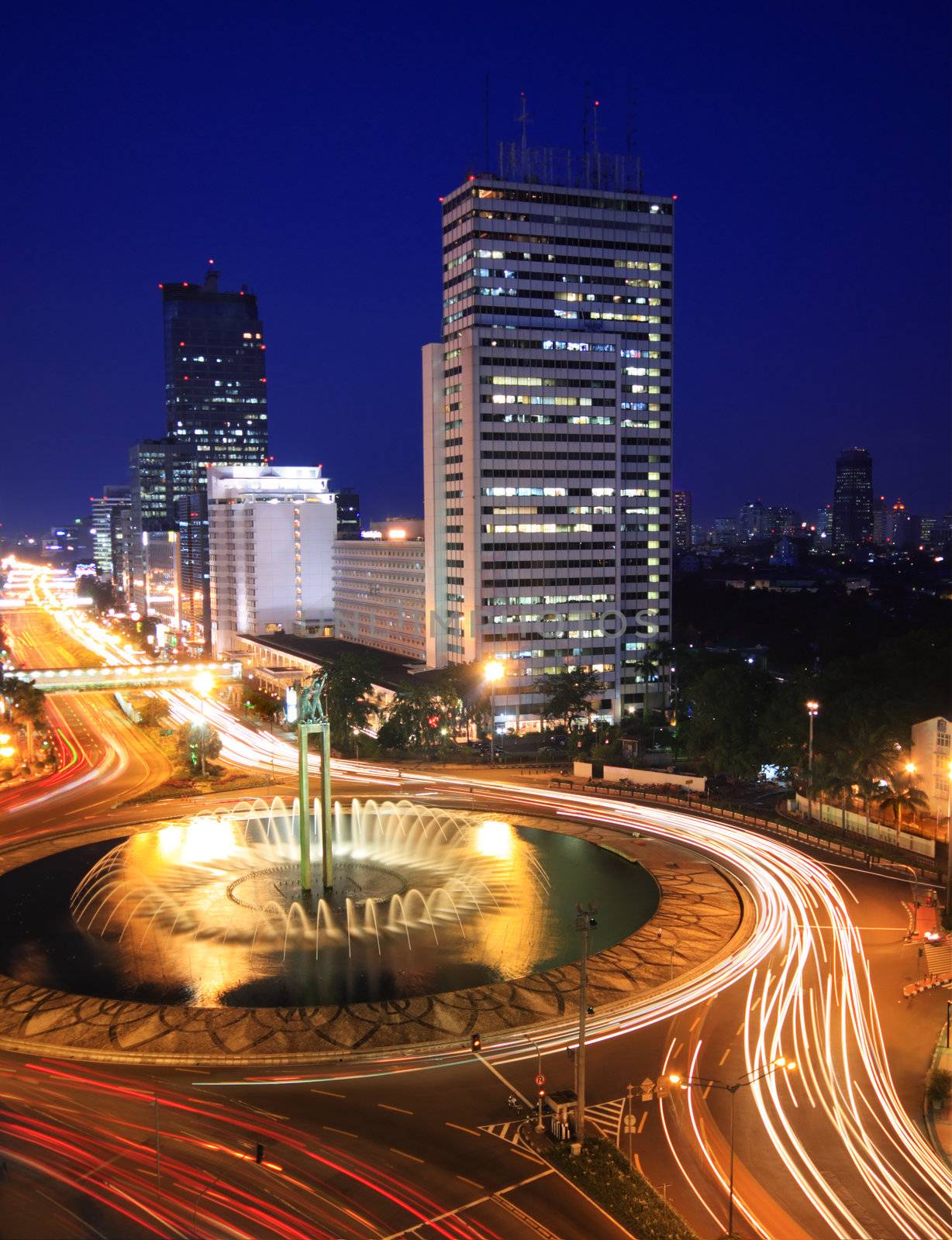 Night time view of traffic in the center of business district in Jakarta