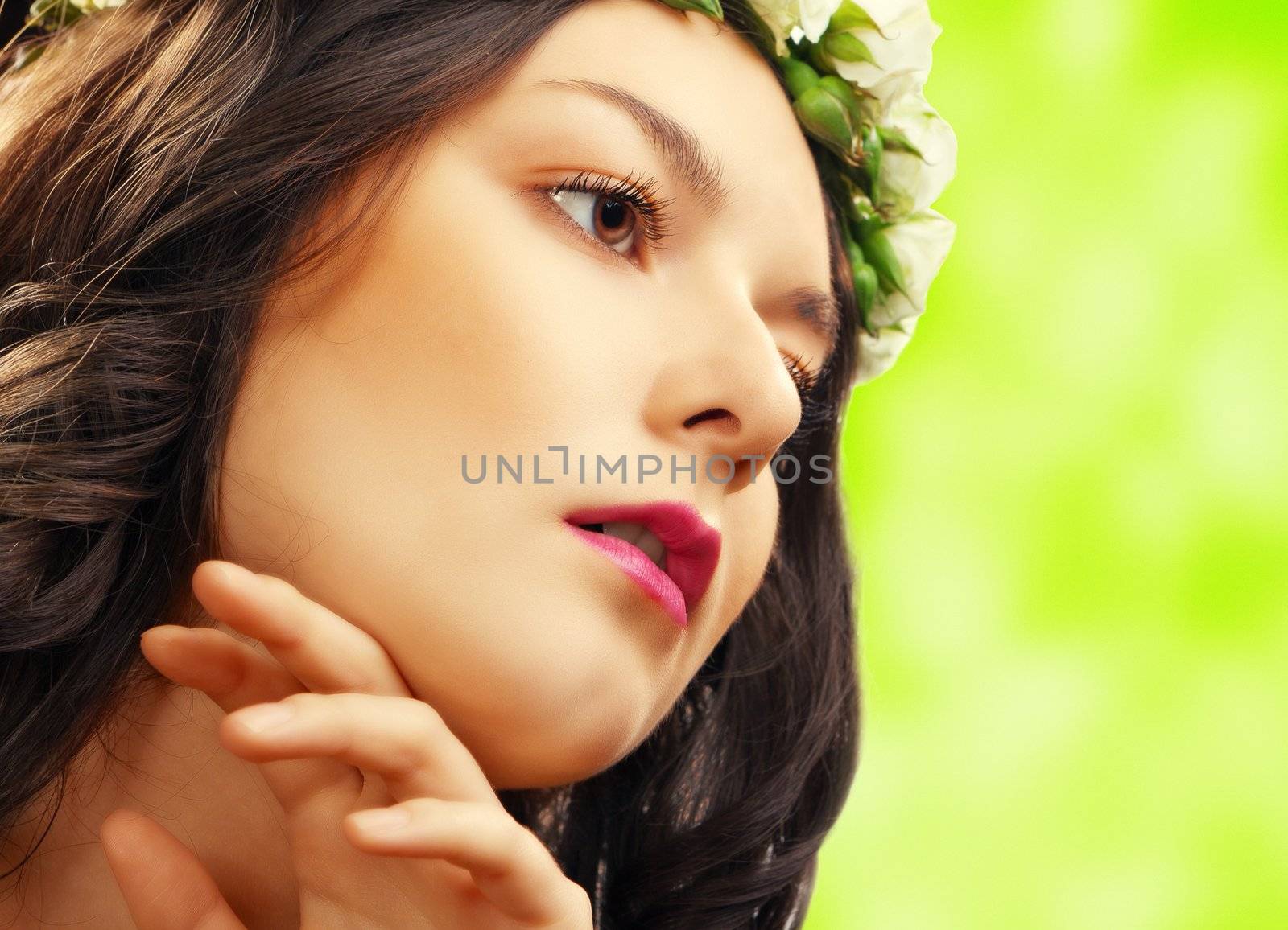 beauty woman with flower on green background