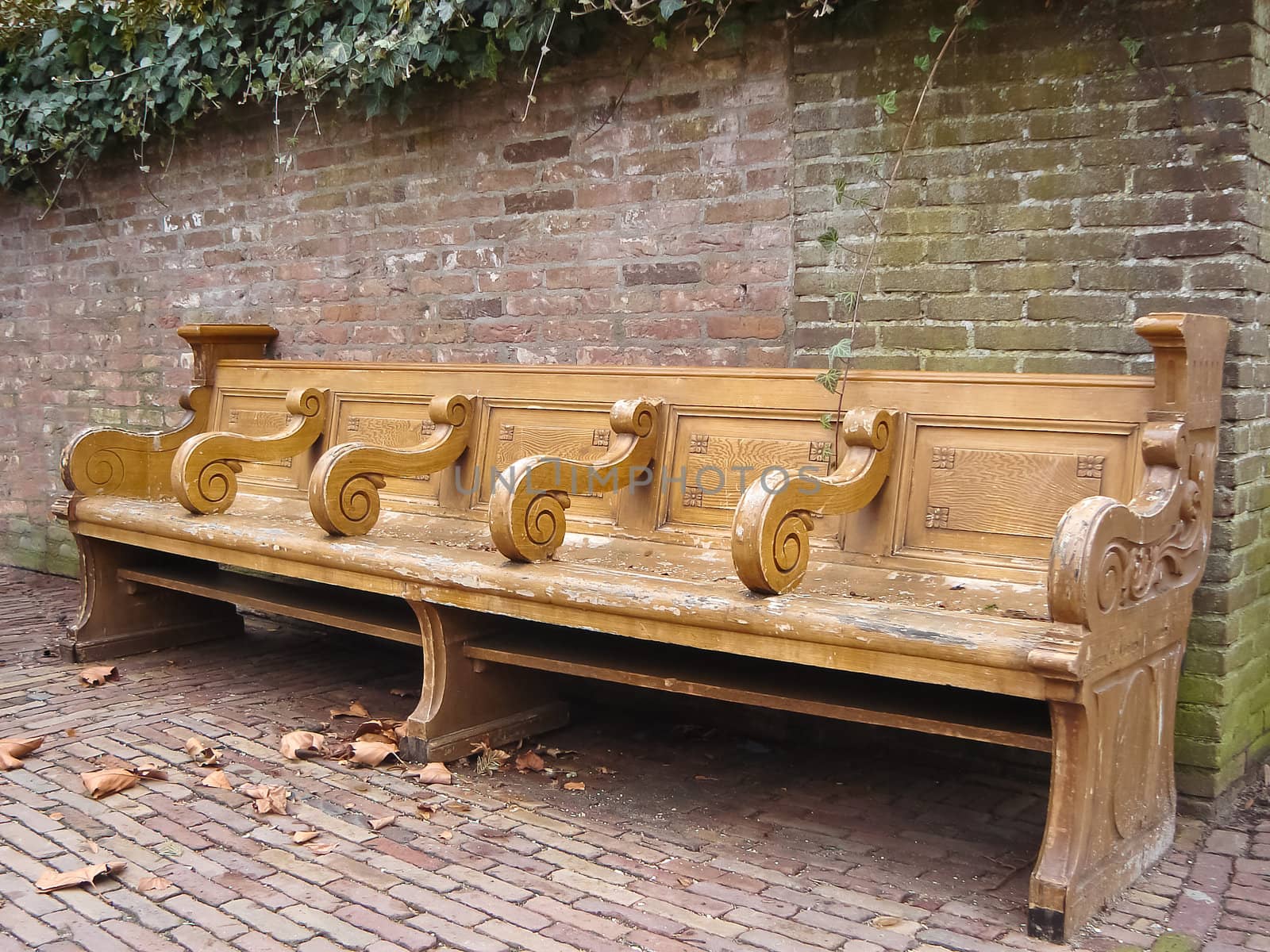 Old bench in city park by NickNick