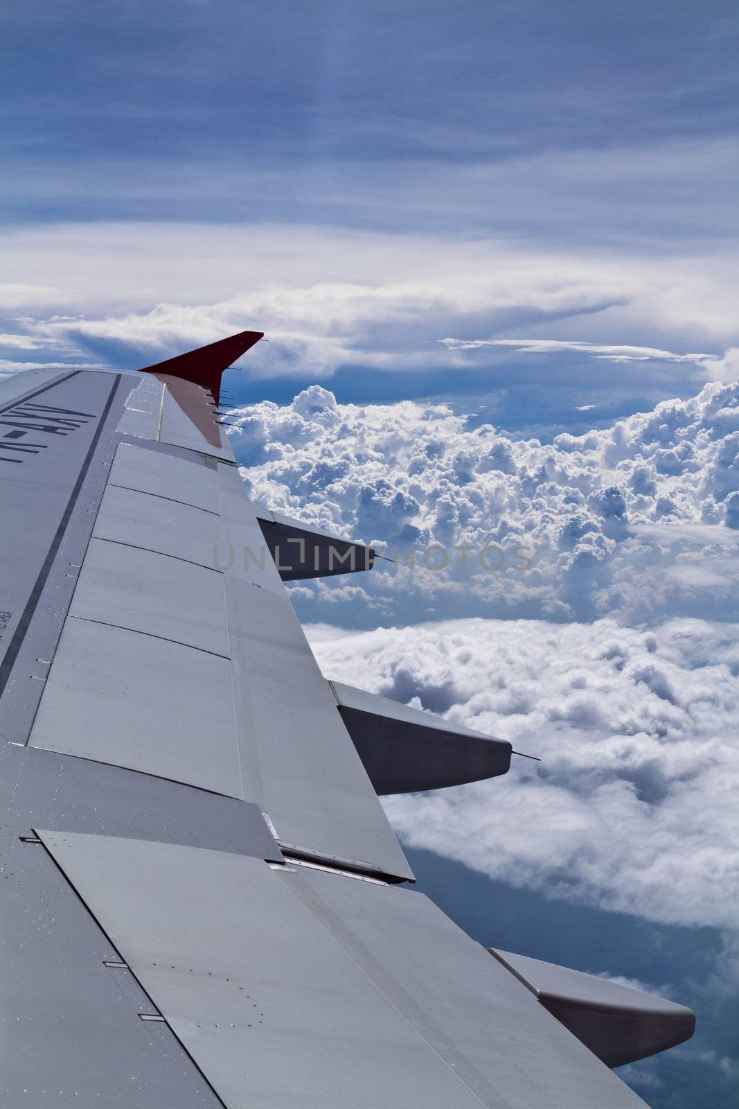 View of white puffy clouds on board flight