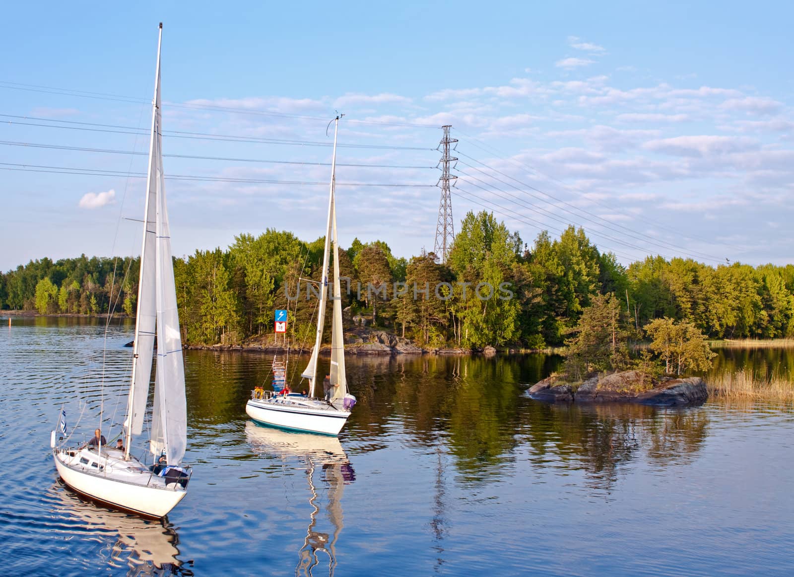 Two yachts on Saimaa lake in a calm summer evening