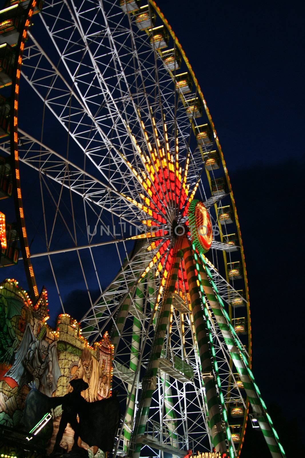 fun fair attraction ferris wheel at night