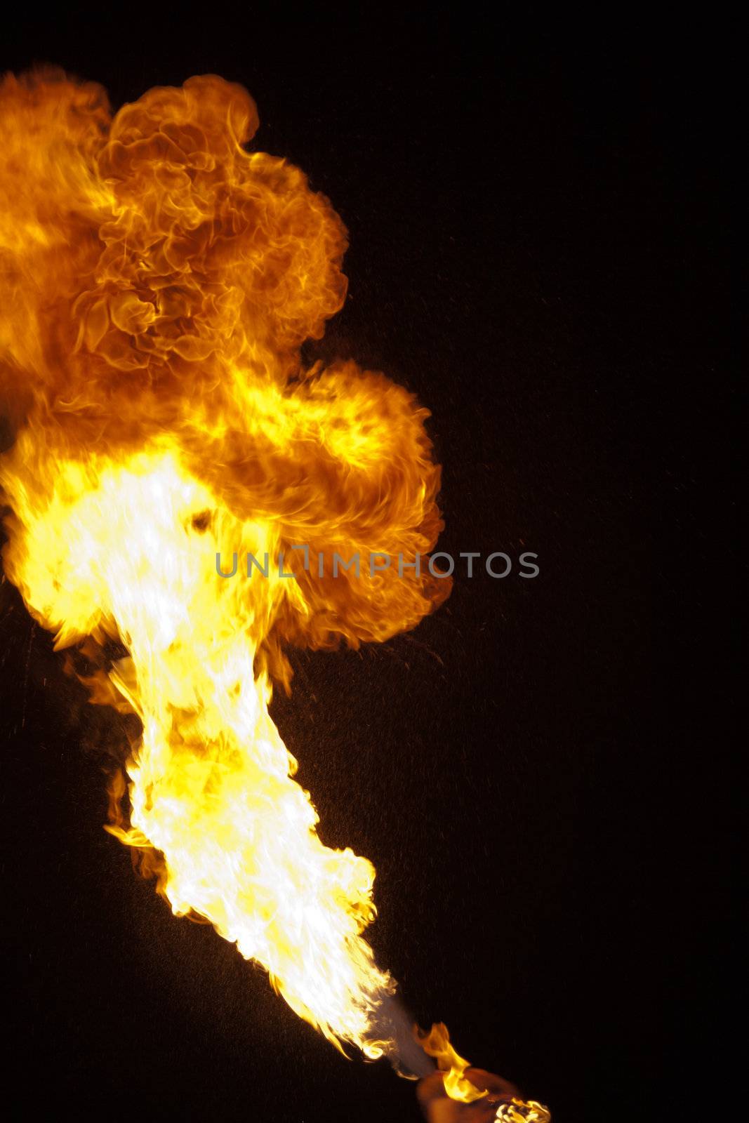 Fire explosion from an fire-breather in the Night