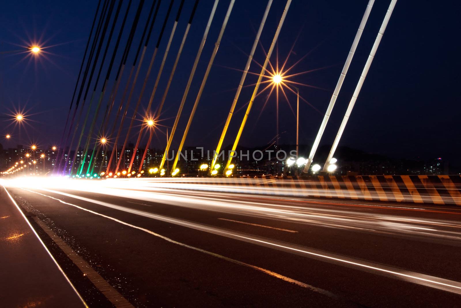 Traffic light traces on the cable-stayed bridge in night