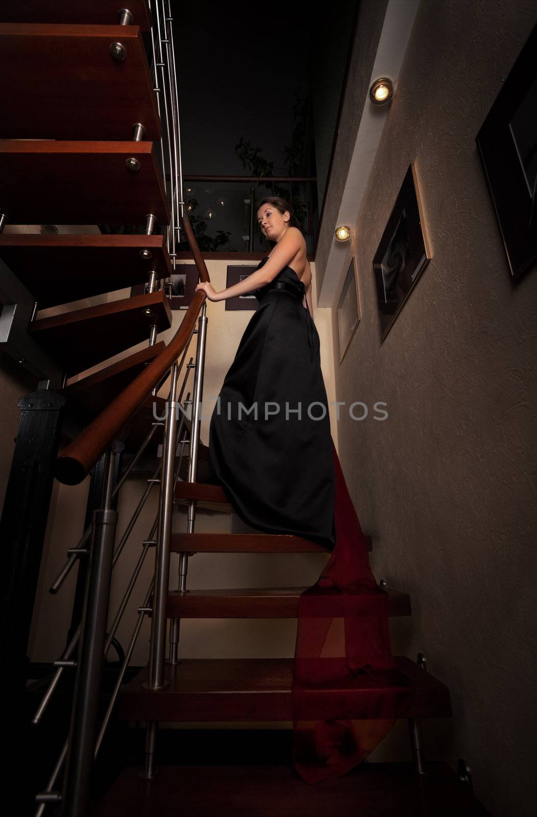 	aristocratic lady on stairs in luxury house