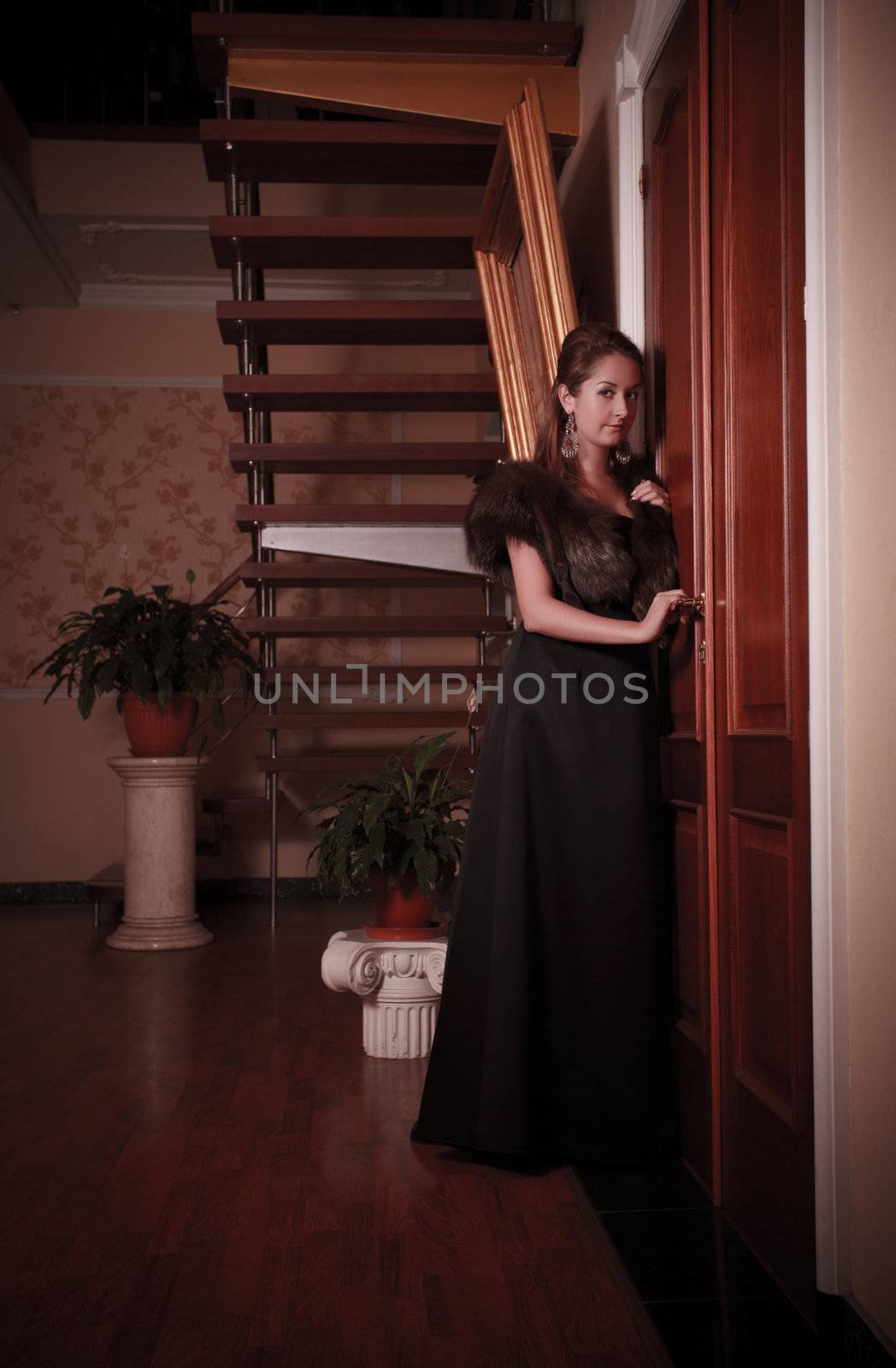 aristocratic lady eavesdropping near closed door