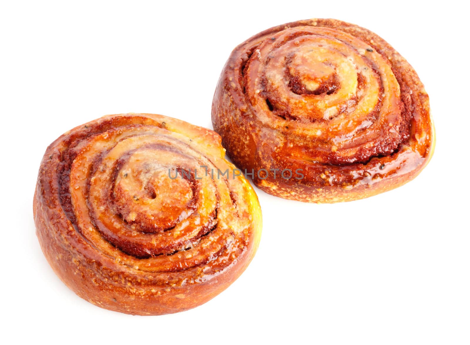 two sweet buns with cinnamon isolated on white