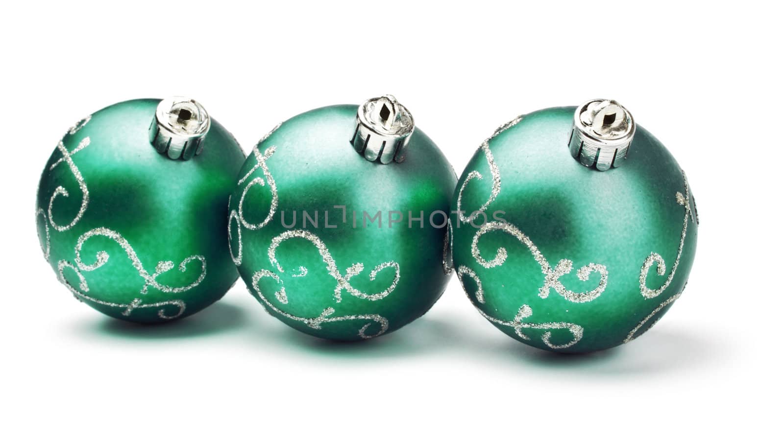 three green decoration balls isolated on white