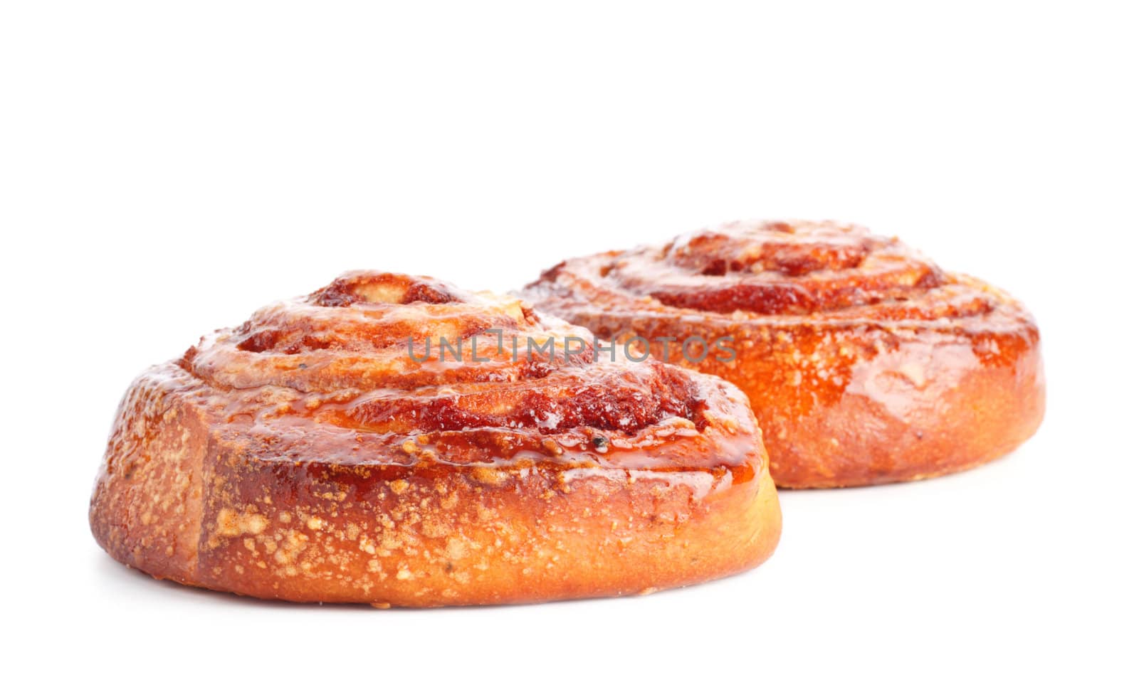 two sweet buns with cinnamon isolated on white
