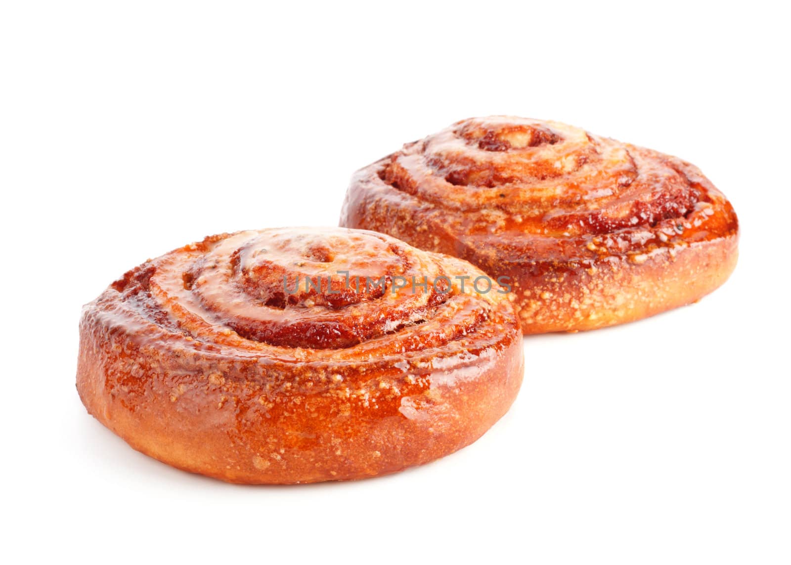  two sweet buns with cinnamon isolated on white