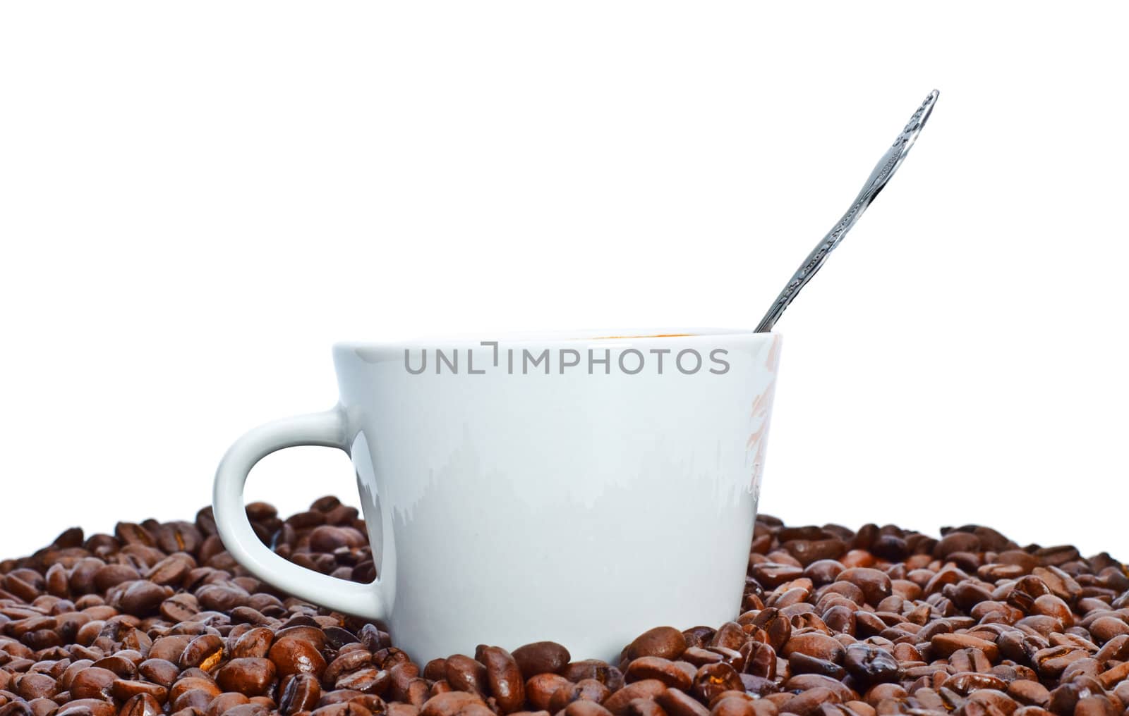 espresso cup in coffee beans, isolated on white