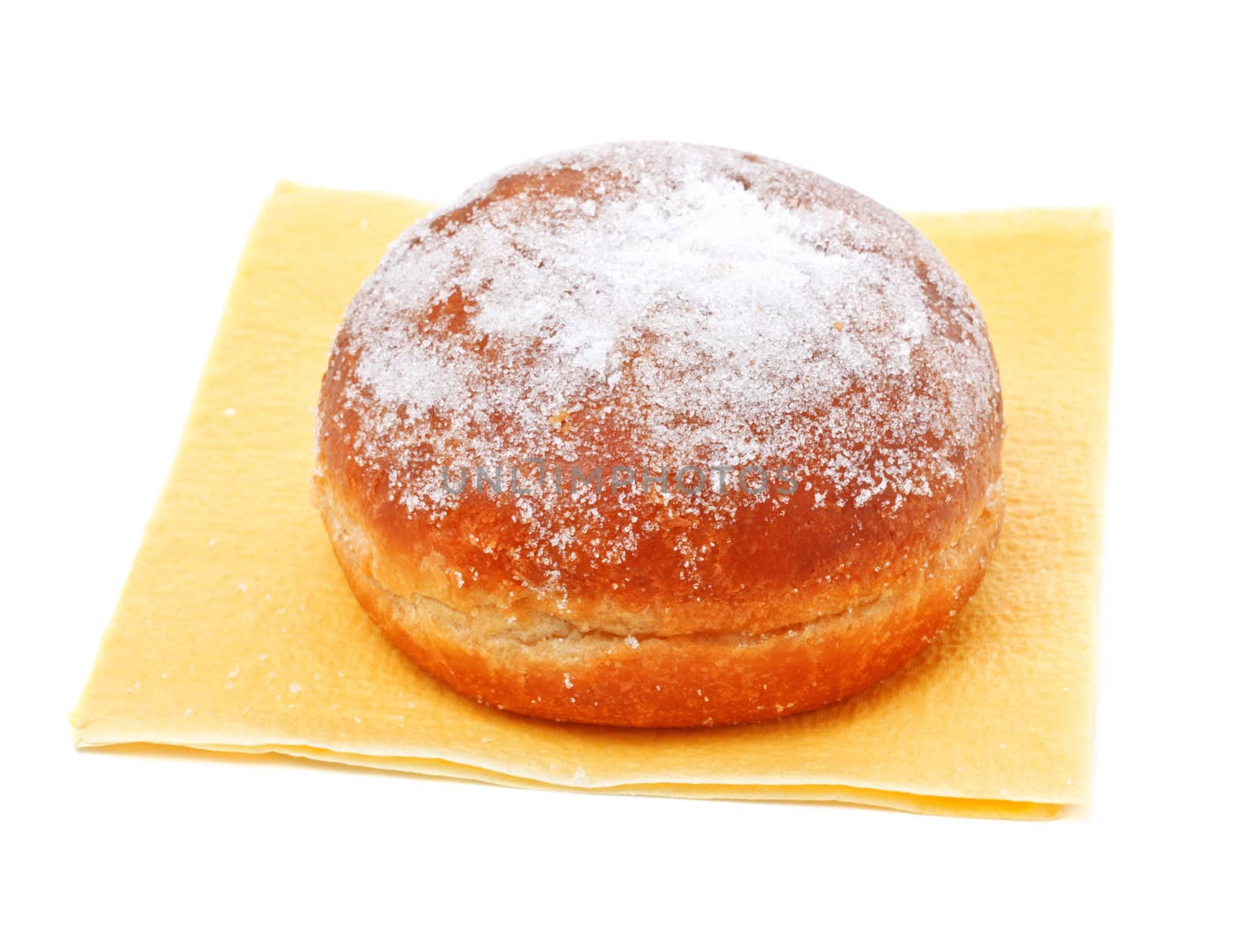 donut in powdered sugar on paper napkin