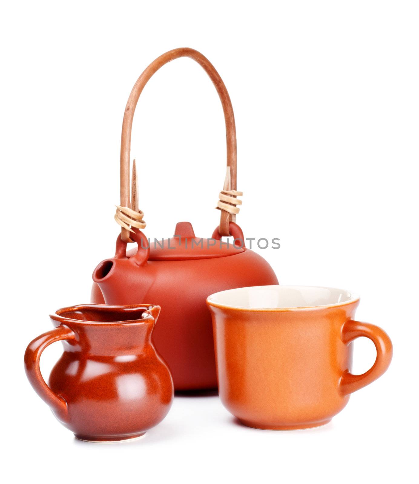 clay kettle, cup and jug isolated on white