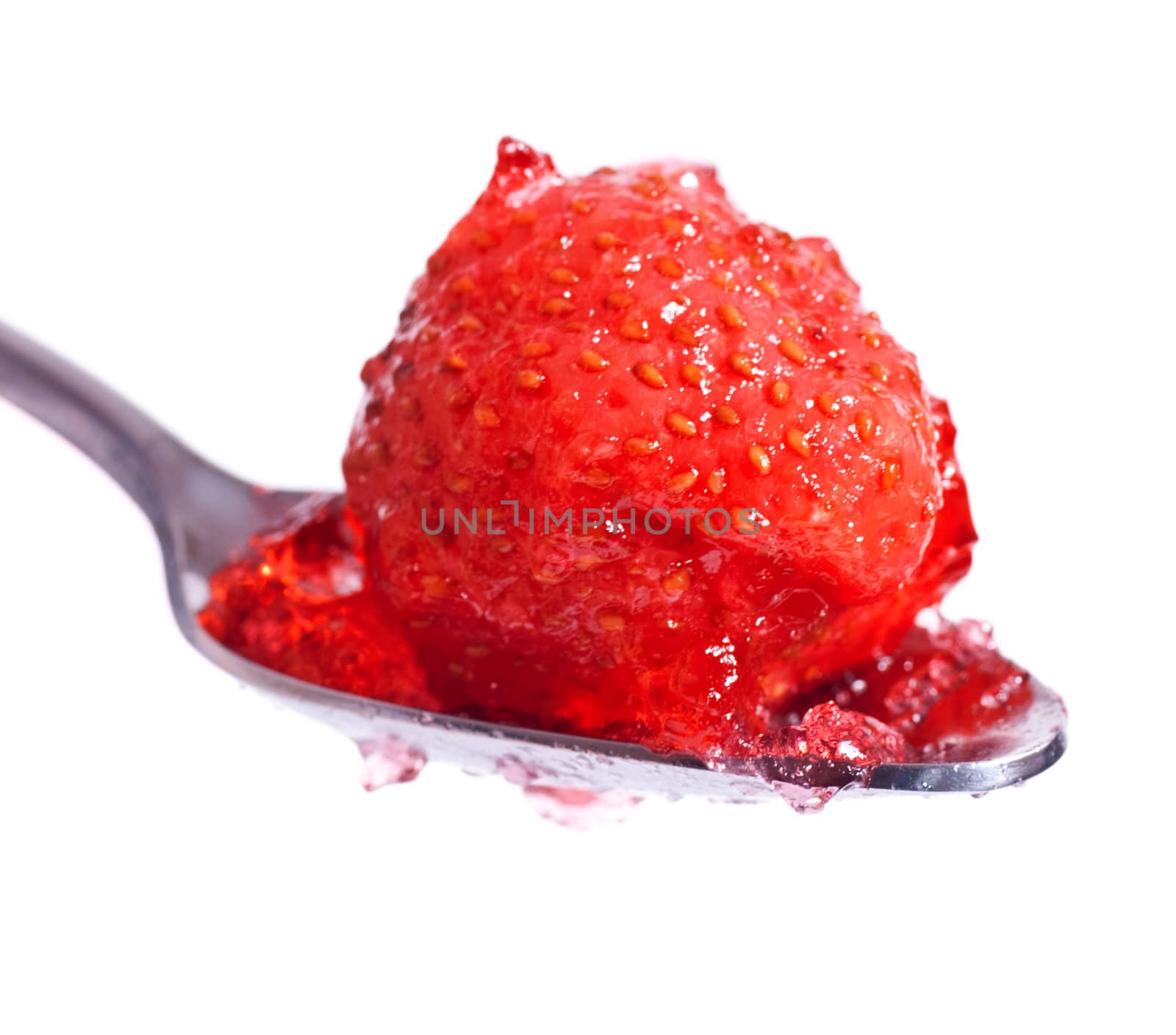 strawberry jelly on spoon isolated on white background