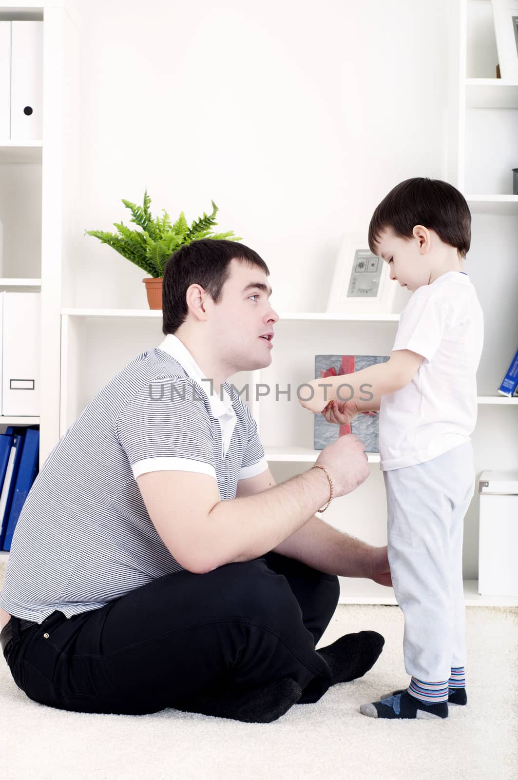 Father and son spend time together, playing at home