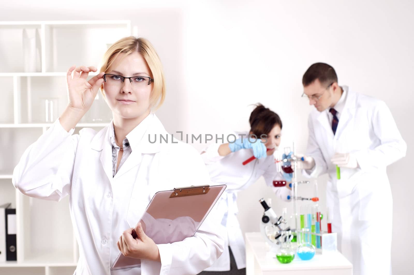 portrait of doctor, holds a tablet in the office