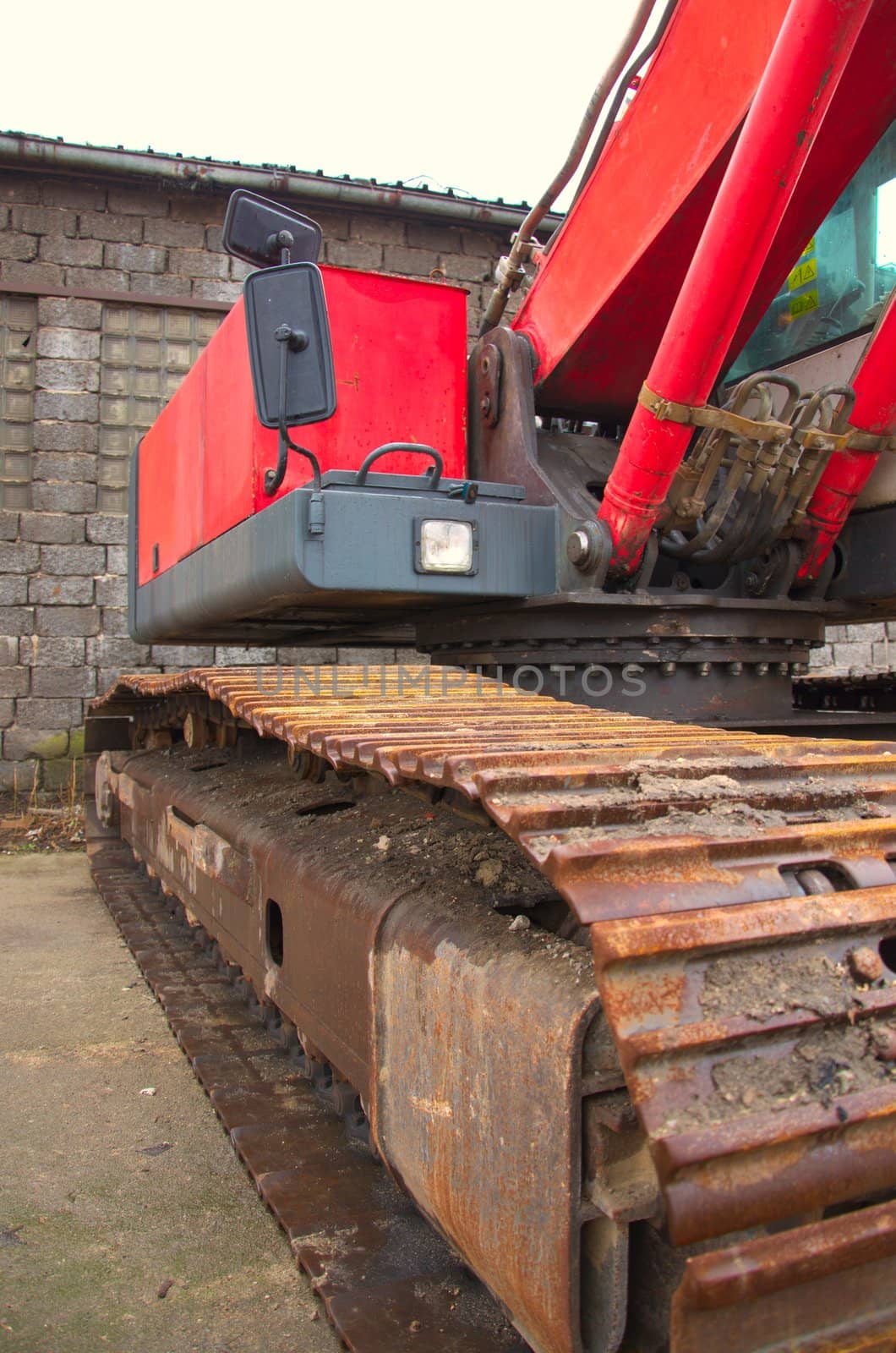 Red excavator on a construction site