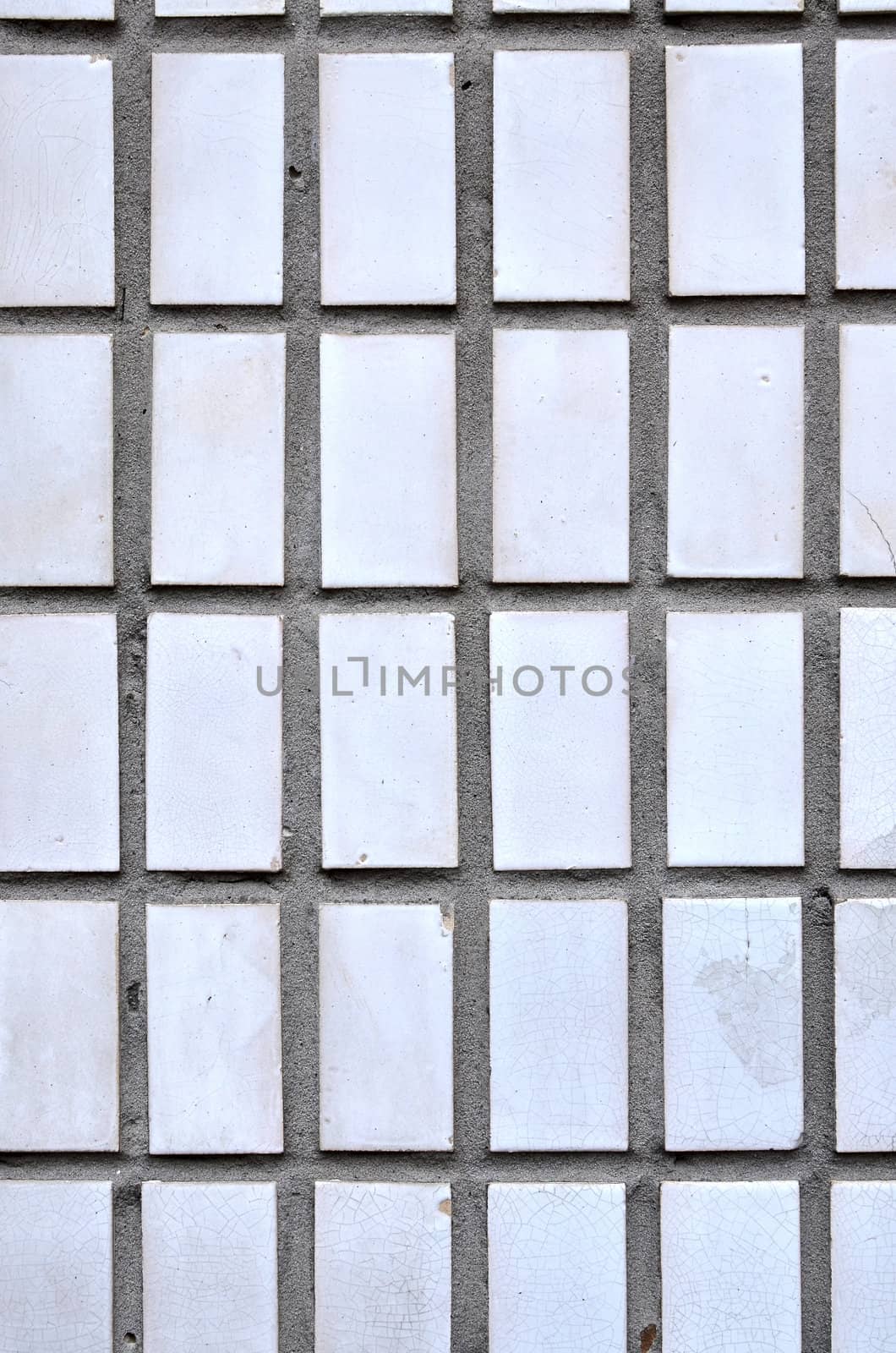white ceramic mosaic wall tile as textural background by DNKSTUDIO