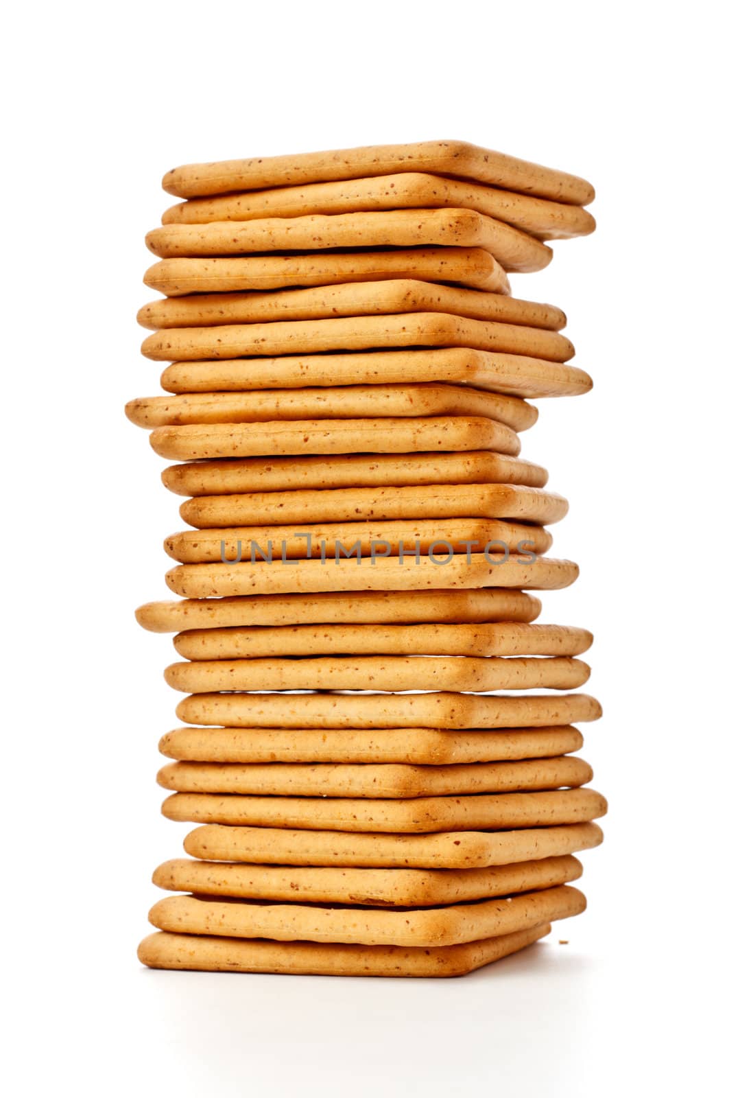 salty crackers pile isolated on white background