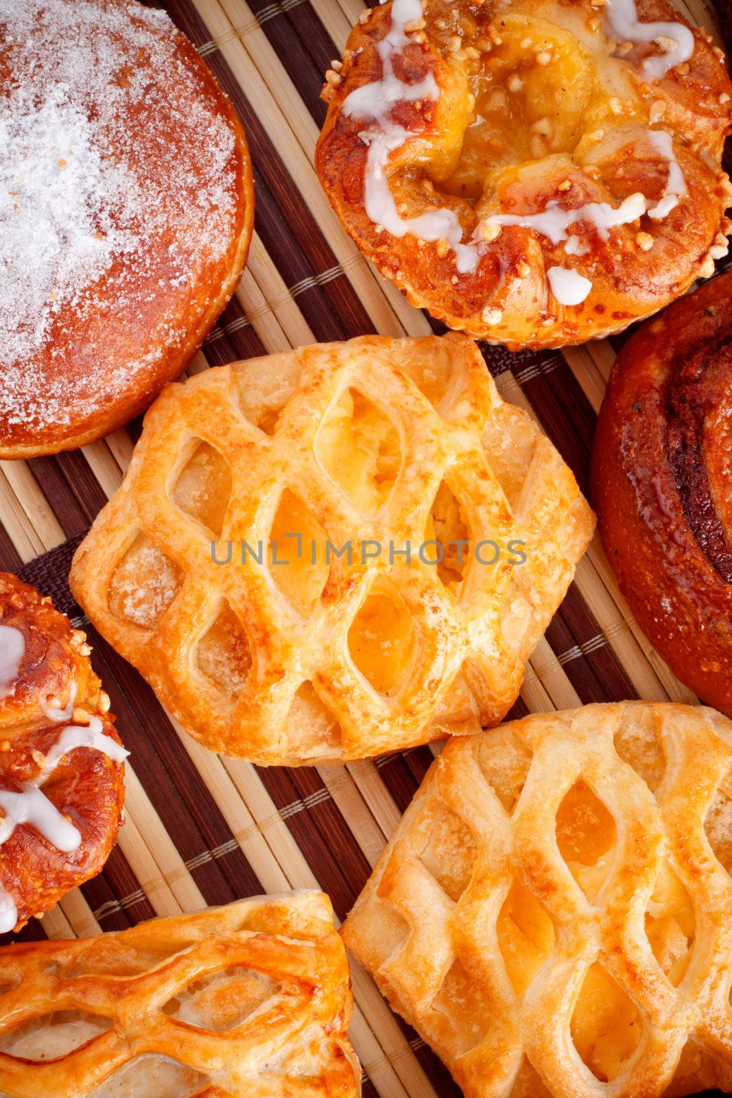 different types of biscuits on bamboo napkin, top view