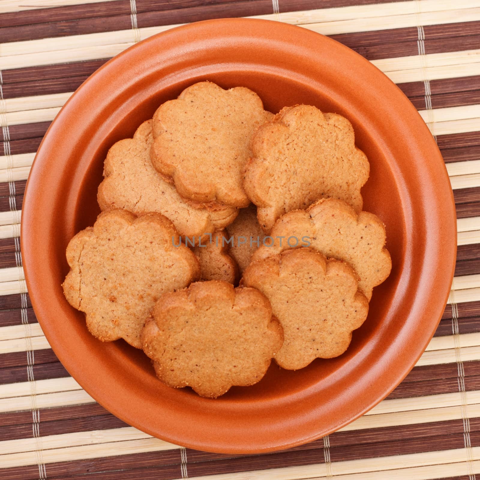 dish of cinnamon cookies by petr_malyshev