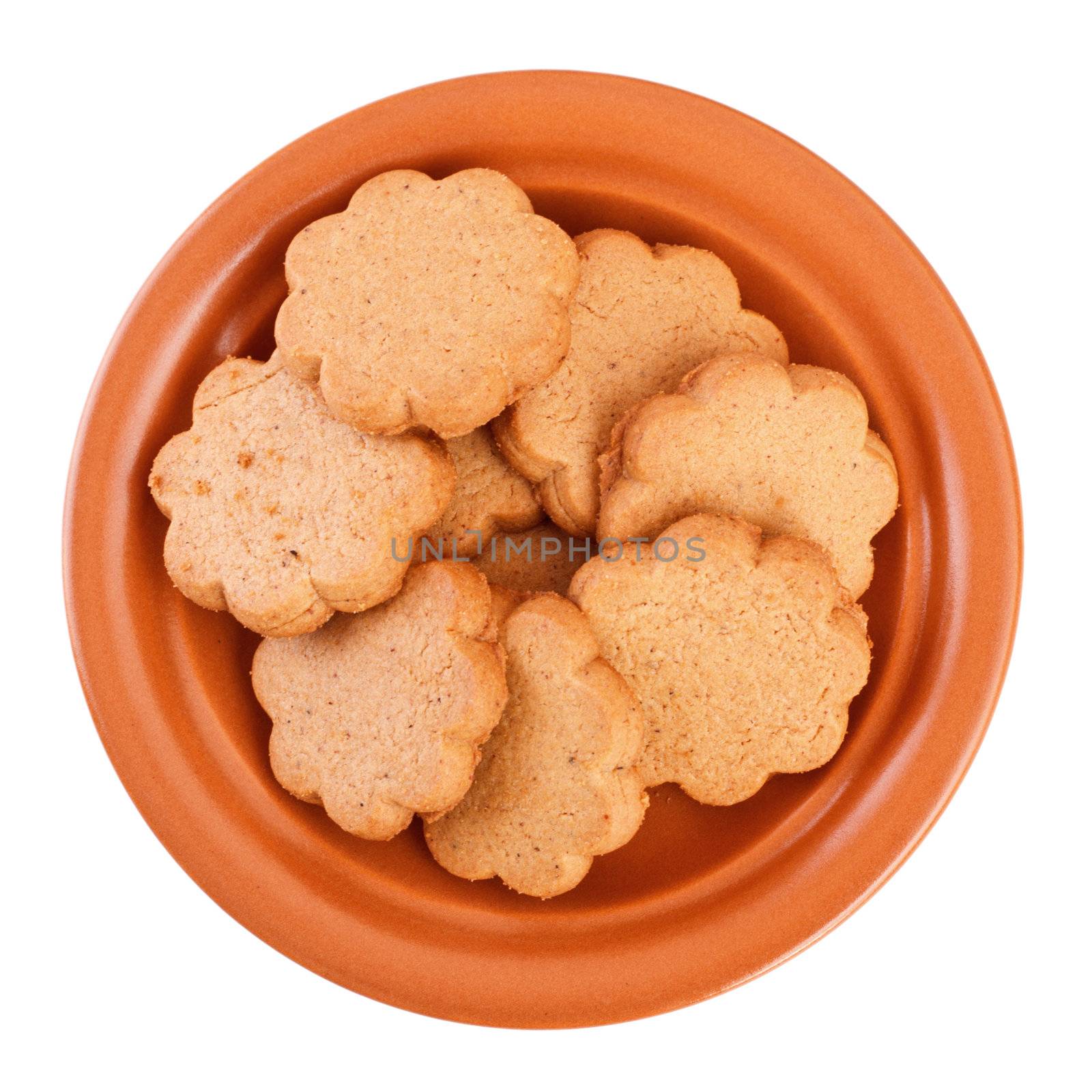 dish of cinnamon cookies isolated on white